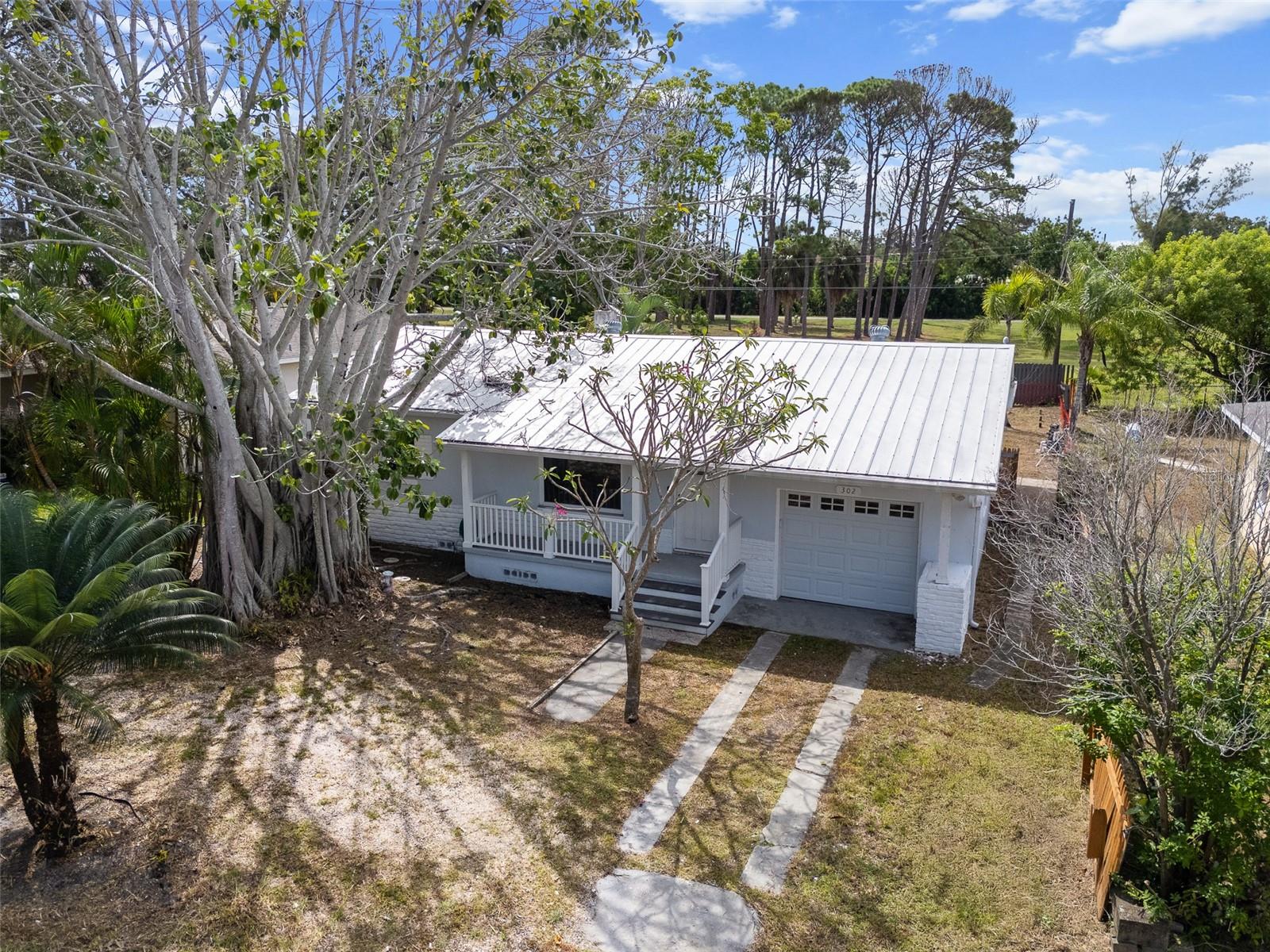 Welcome to this 2-bedroom, 1.5-bathroom pool home, ready for your creative vision. This home has been professionally remediated, providing a clean slate for you to design and rebuild the home of your dreams. All the demolition work has been completed, giving you a valuable head start on your project. The home offers a functional floorplan with two bedrooms and a bonus room, perfect for a home office, media room, or personal gym. Outside, your private paradise awaits in the spacious backyard with a large pool, offering the perfect backdrop for creating lasting memories all while backing up to Rio Vista Park. Practical features include a durable metal roof installed in 2016, hurricane impact windows, and an oversized one-car garage with a versatile loft storage space. This property is conveniently located near the Gandy Bridge for easy access to Tampa and is close to local attractions like Riviera Bay Park, Mangrove Bay and Cypress Links Golf Course, Speer YMCA, Weedon Island Preserve, and Downtown St. Pete.