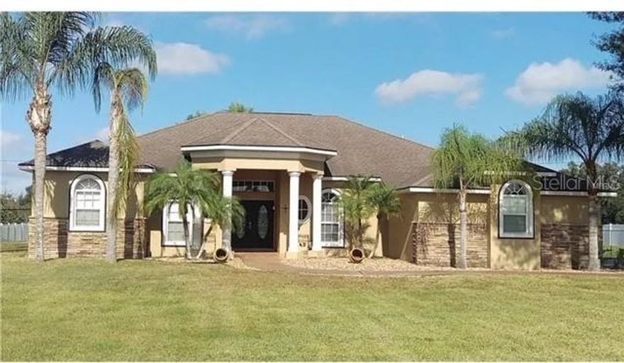 Private country escape, no HOA or CDD fees! Home with land, privacy and backyard workshop, garden, fire pit and cook shed. This Tampa/Dover beauty checks all the boxes. Set on 1.03 acres along a private road, this custom 4-bedroom (plus den/bonus room) home offers over 3300 sq ft of living space, 2-car garage, plus large workshop. Brand new roof in 2024, split AC unit one replaced in 2018 and the other replaced in 2022. You will love the open layout with high ceilings, natural light, and seamless flow between the great room , dining and kitchen areas - perfect for family gatherings. Enjoy the wood burning fireplace on those cold nights. The primary suite feels like a spa retreat, featuring large walk-in closet, double vanity, large jacuzzi tub, and walk in shower; including a large seating area. The bonus room has built in wall unit and can easily be an in-law suite with a separate entrance. Jack and Jill bathroom with two large bedrooms. Outside enjoy the large tiled patio, cook shed, fire pit area, work shed (with water and electric), garden and chickens. Best part is no HOA or CDD fees. Located in Dover where you will have country living while still just minutes from I-4, Tampa, Lakeland and only 1 hour from Disney and Universal. This home gives you space, privacy and style - come see whey life feels a little calmer here. The master suite is a true retreat, offering a peaceful sanctuary to relax and unwind