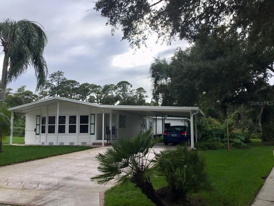 SPACIOUS Beautiful 2 bedroom Palm Harbor with open living and dining room.  Large island kitchen. Pantry and lots of cabinets. Family room has a wet bar.  Kitchen and family room look out to the large screen porch. Large Bay Windows in the living room.  New vinyl has been purchased for the screen windows but need installed. New plank flooring in almost every room installed 8/2019.  New roof 2018, A/C 2012, garbage disposal, refrigerator, washer and dryer 2014.  Inside laundry room with a separate outside door.  Cabinets in the laundry room.  Shed.  Covered carport holds several cars.  Sidewalk from driveway to the porch. Private backyard.  On a cul-de-sac.  Short walk to the clubhouse and activities. Immediate occupancy.

Edgewater Landing is located on the intracoastal with a boat or kayak access for residents only. Intracoastal fishing pier. Fitness center, woodworking shop, ceramics with kiln, tennis, bocci, shuffleboard, horseshoes, inside game room with pool tables, heated pool, screened sauna, entertainment committee (activities, dances, etc.).  RESORT LIVING EVERY DAY! HOA includes either a boat or RV space when available, cable and internet. ;Water: City