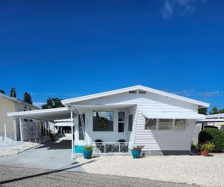 Steps Away from the sparkling waters and spectacular sunsets of Sarasota Bay! Prime location!...just across the street from the community pool, recreation buildings, shuffleboard and fitness center of the highly desired, active 55+ Trailer Estates community. Light, bright open concept living, dining and kitchen; this 1 Bedroom, 1 Bath Classic Vintage Mobile Home is newly updated with new laminate floors throughout, new kitchen cabinets, new backsplash, new range and refrigerator. New portable AC in living room. Freshly painted inside and out. Relaxing Screen Porch/Breezeway has new indoor/outdoor carpet and washer/dryer hookups. Rear deck to sun or entertain your family and friends. 6 x 7 Shed/Workshop. You own the land. Boaters have direct access to Sarasota Bay from the Marina. Enjoy the large, heated community pool, hot tub, gym and wood shop. The community buzzes with pickleball, shuffleboard, kayaking, horseshoes, bocce, dancing and more. A US Post Office on site. 10 minutes to the SRQ Airport. Convenient to shopping, restaurants, the Arts and everything in/around Bradenton/Sarasota. Sold AS-IS with right to inspect. Sold unfurnished.
