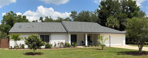 Photo of 7432 Sparkling Lake Rd, Orlando, FL 32819 (MLS # O6396817)