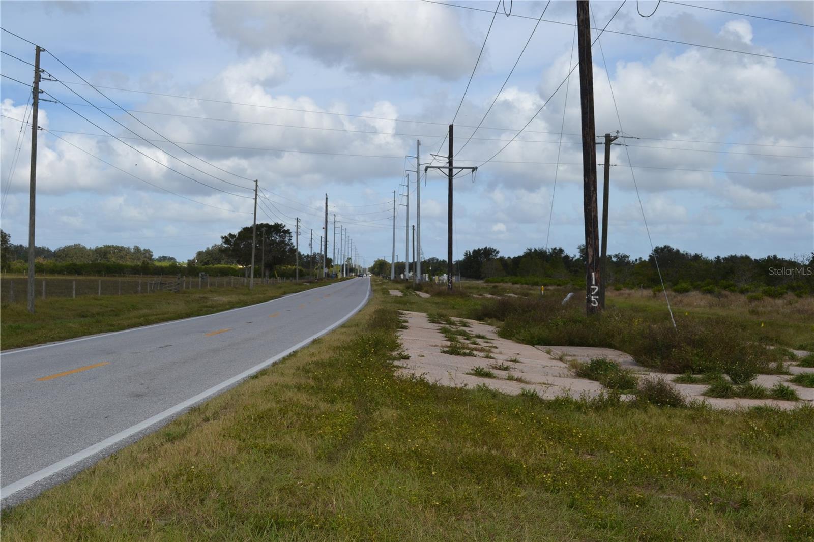 Currently an active citrus grove operated with adjoining parcels to the south. The property has a great view of Bok Tower to the west. Could be a single family home site of combined and developed for residential.