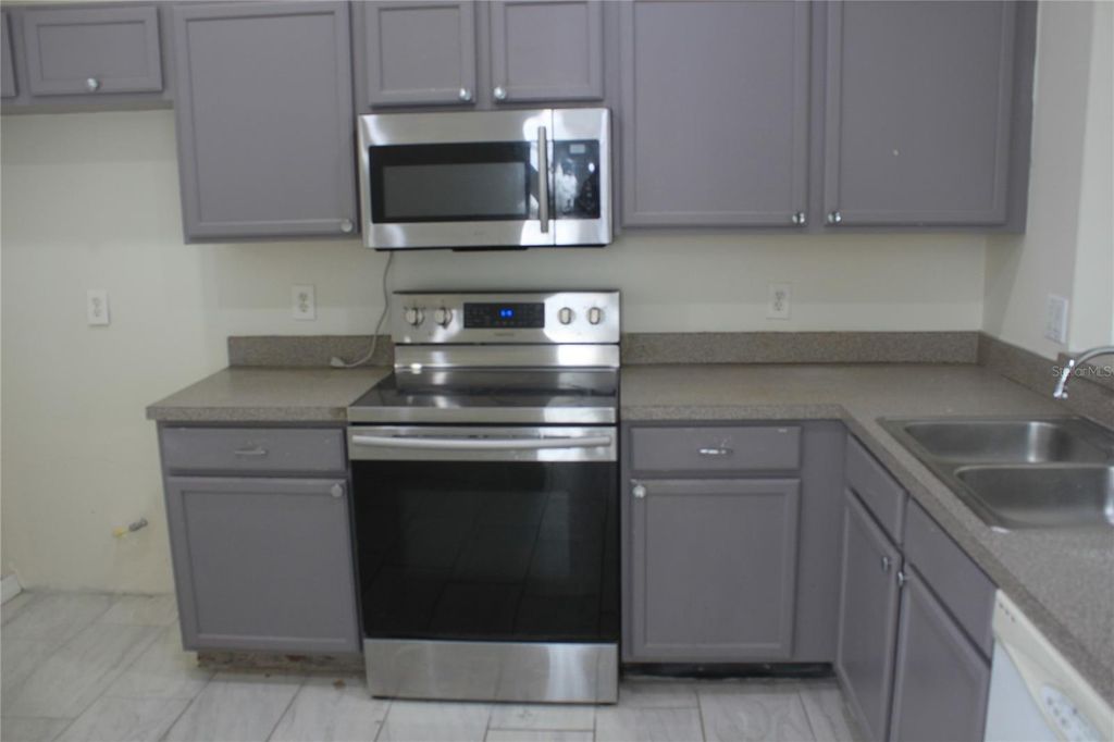 Photo of 1819 Meadow Pond Way, Orlando, FL 32824 (MLS # O6367061)