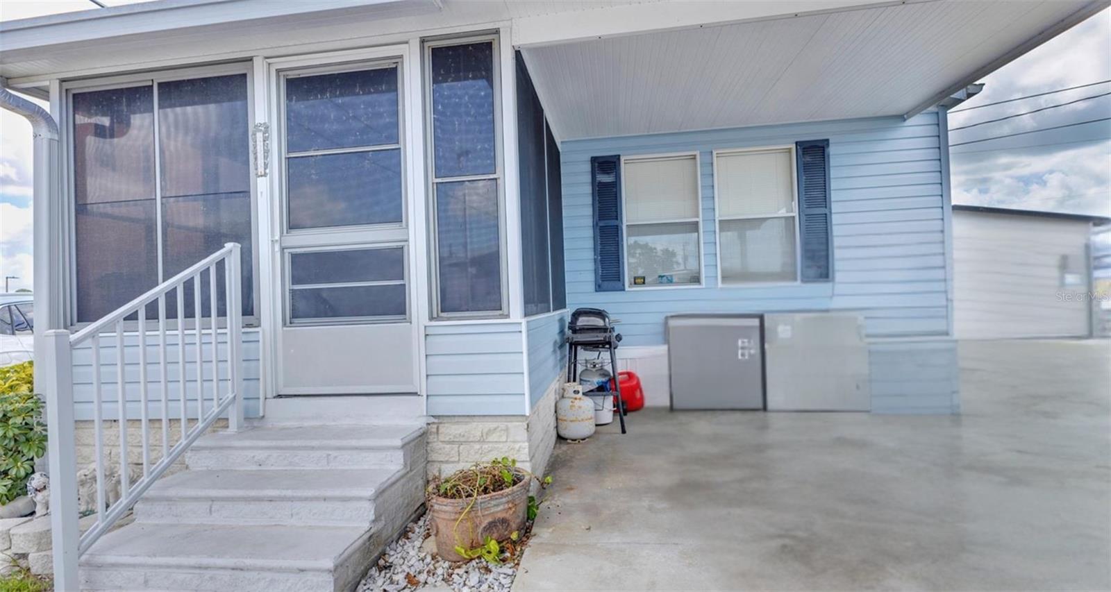 MOBILE ESTATES is one of the most popular mobile home parks in Sarasota. Located less than 2 miles from the famous Siesta Key beach, and surrounded by numerous stores, eateries, multiple ethnic restaurants, pubs, boutiques, banks, Publix - just about everything you need. This 55+ community is extremely active with gatherings around the pool or spa, parties in the clubhouse, friendly shuffleboard tournaments. It has one main entrance, and owners enjoy two extras. This double-wide built in 2004 has been owned by the same family since it was built. Newer roof (2023), newer refrigerator, inside laundry with full-size washer & dryer and second door to the side yard. Front porch is closed in. Two bedrooms, each with walk-in closets, and two baths. Bright kitchen adjacent to dining & living rooms. One attached carport with extra drive space. Sorry, dogs are not allowed, but you can bring your kitty cat. If you like activity, it's in and around this Mobile Home Park! By the way, this manufactured home did not suffer damage from the 2024 hurricanes.