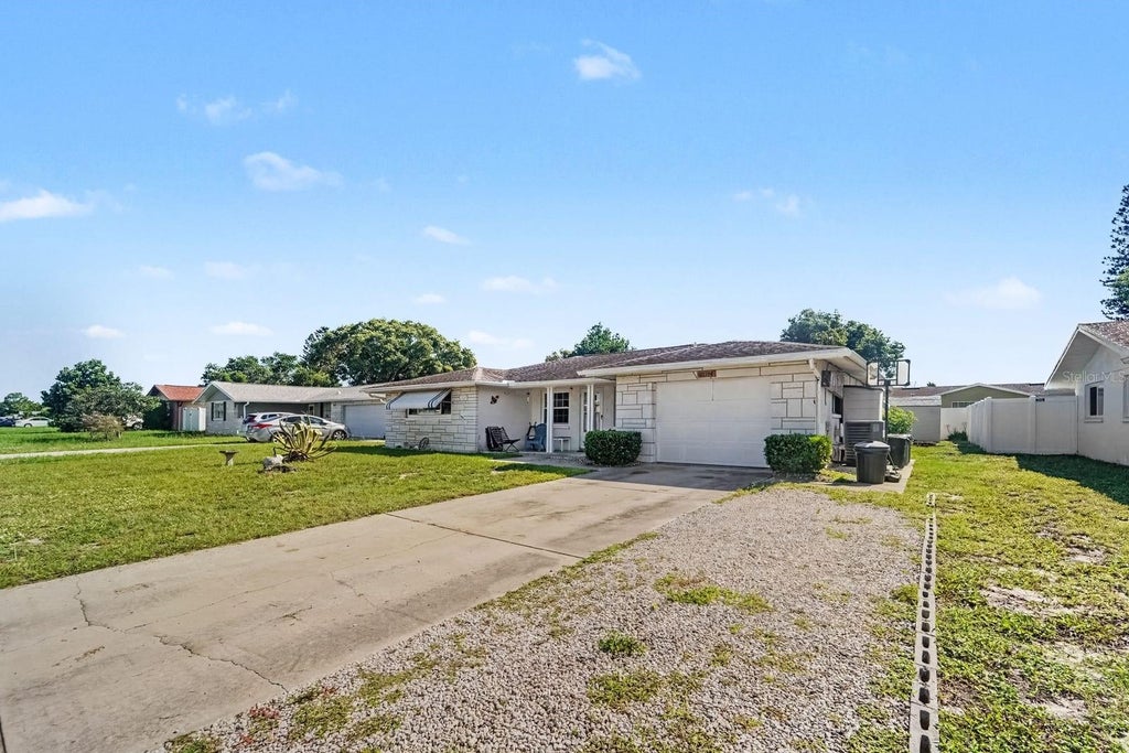 Photo of 10214 Holly Drive, Port Richey, FL 34668 (MLS # TB8548946)