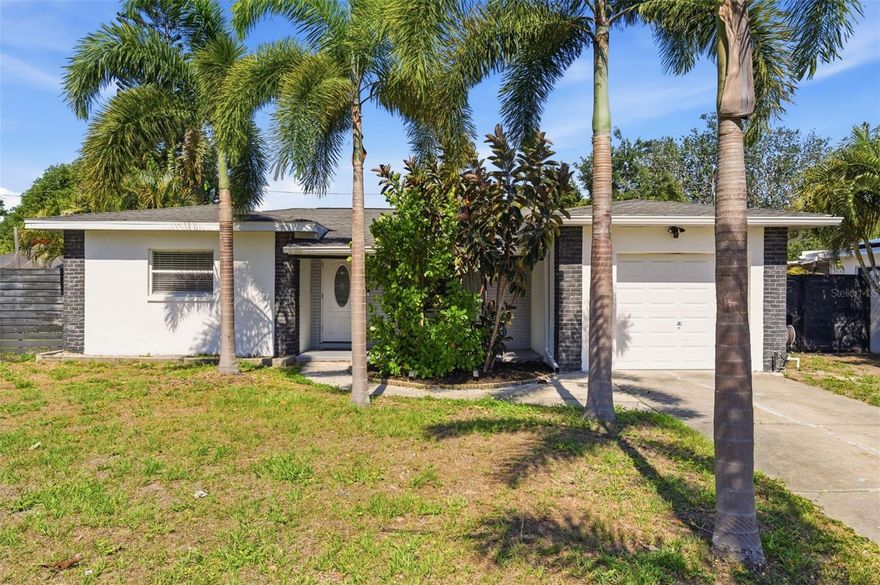 Move-in ready 3-bedroom, 2-bath home in a PRIME St. Petersburg LOCATION! Recently renovated and thoughtfully updated, this home offers a bright open layout, split-bedroom design, and a newly added living space. Important upgrades have already been completed, including the NEWER ROOF, AC, water heater, and fence, all updated within approximately the last 5 years.

The modern kitchen features stone countertops, soft-close drawers, and quality appliances. The spacious owner’s suite opens to the backyard and includes a beautifully updated en-suite bath with dual sinks and a walk-in shower with dual shower heads.

Step outside to a private fenced backyard with tropical landscaping, brick paver entertaining space, gazebo with electric, storage shed, and double-gate access for boat, RV, or extra parking. The yard also offers room for a future pool. Close to parks, shopping, dining, and just minutes from Gulf beaches. No flood insurance required!
