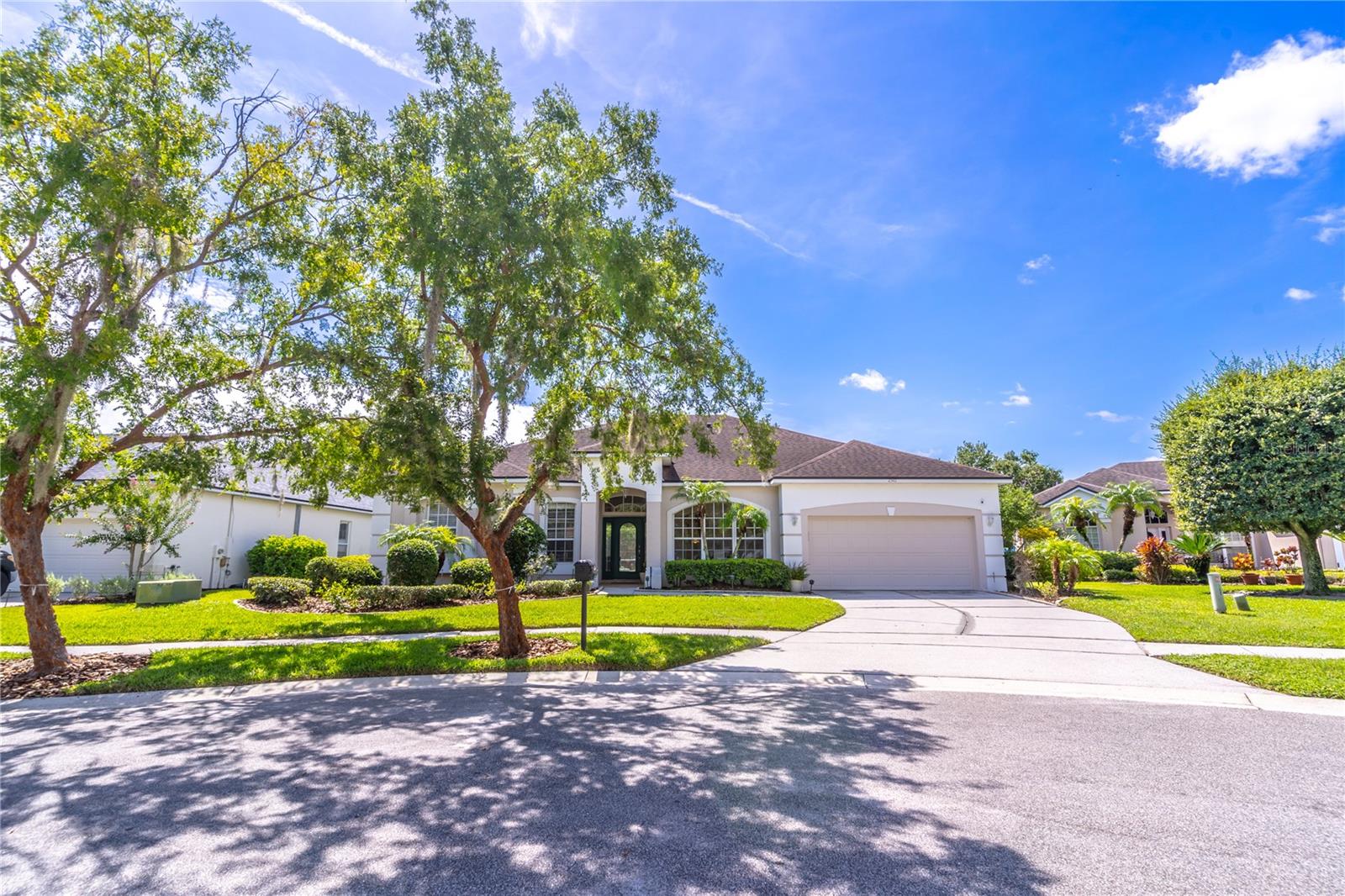 This wonderful split plan pool home is located in the desirable Wesmere neighborhood. Once entering the home, you are greeted by an open and bright floorplan with beautiful archways leading you throughout the home. The living room greets you immediately off the foyer and has direct access to the patio and pool area. A formal dining room has a gorgeous picture window providing wonderful natural light. The large kitchen showcases ample cabinet space, a built-in desk area, closet pantry, breakfast bar and eat-in area all open to the family room. The family room provides a fireplace with a lovely mantel and sliders that lead to the covered patio and pool. Additionally, off the foyer is a dedicated office with double doors for privacy and an additional side door providing access to the primary bathroom. The primary bedroom is a true retreat, separate from the other bedrooms and offers loads of space and dual walk-in closets. The primary bathroom includes a dual sink vanity, soaking tub, separate shower and water closet. Across the home the 2nd and 3rd bedrooms share a hallway bathroom. The 4th bedroom can be closed off from the family room creating the perfect guest suite complete with full bathroom across from the bedroom. The large, covered patio features ample space to entertain and enjoy the shade on a warm summer day. The screen enclosed pool and spa offers two access doors to the lush backyard. This wonderful neighborhood includes two gated entrances, clubhouse, community pool, tennis courts and much more! Easy access to several shops, restaurants, the 408 & the Florida Turnpike. Welcome home!