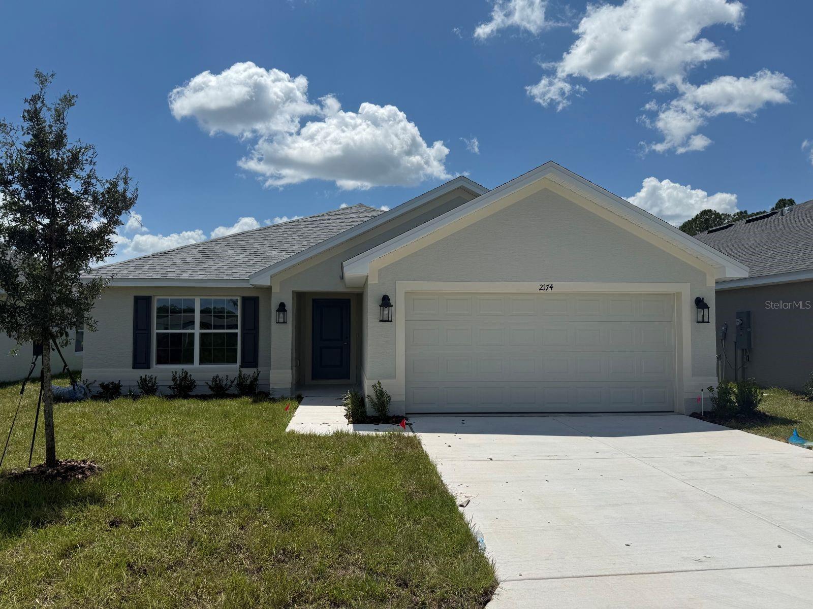 Under Construction. Brand new 1970 sq ft, 3 bed / 3 bath home in a community with nature park/trails nearby, easy access to I-75 and close to Ocala historic district, shopping, and dining. Estimated completion is September. This home features tile in the wet/entertainment areas and carpet in the bedrooms. Home also has granite countertops and shaker cabinets in the kitchen and bathrooms. Kitchen has a stainless steel range, microwave and dishwasher. Owner's bathroom has a garden tub and separate tiled shower. Home also has TAEXX in-wall pest control system and a Builder Warranty. Community Center opening soon with pool, fitness center, community room and playground!! THIS HOME QUALIFIES FOR A LOW INTEREST RATE BUYDOWN, APPLIANCES, AND MORE WHEN BUYER CLOSES WITH A SELLER APPROVED LENDER AND SIGNS A CONTRACT BY SEPTEMBER 7, 2025. INTERIOR PICTURES FROM SIMILAR HOME WITH SAME FLOOR PLAN. OPTIONS AND COLORS MAY VARY.