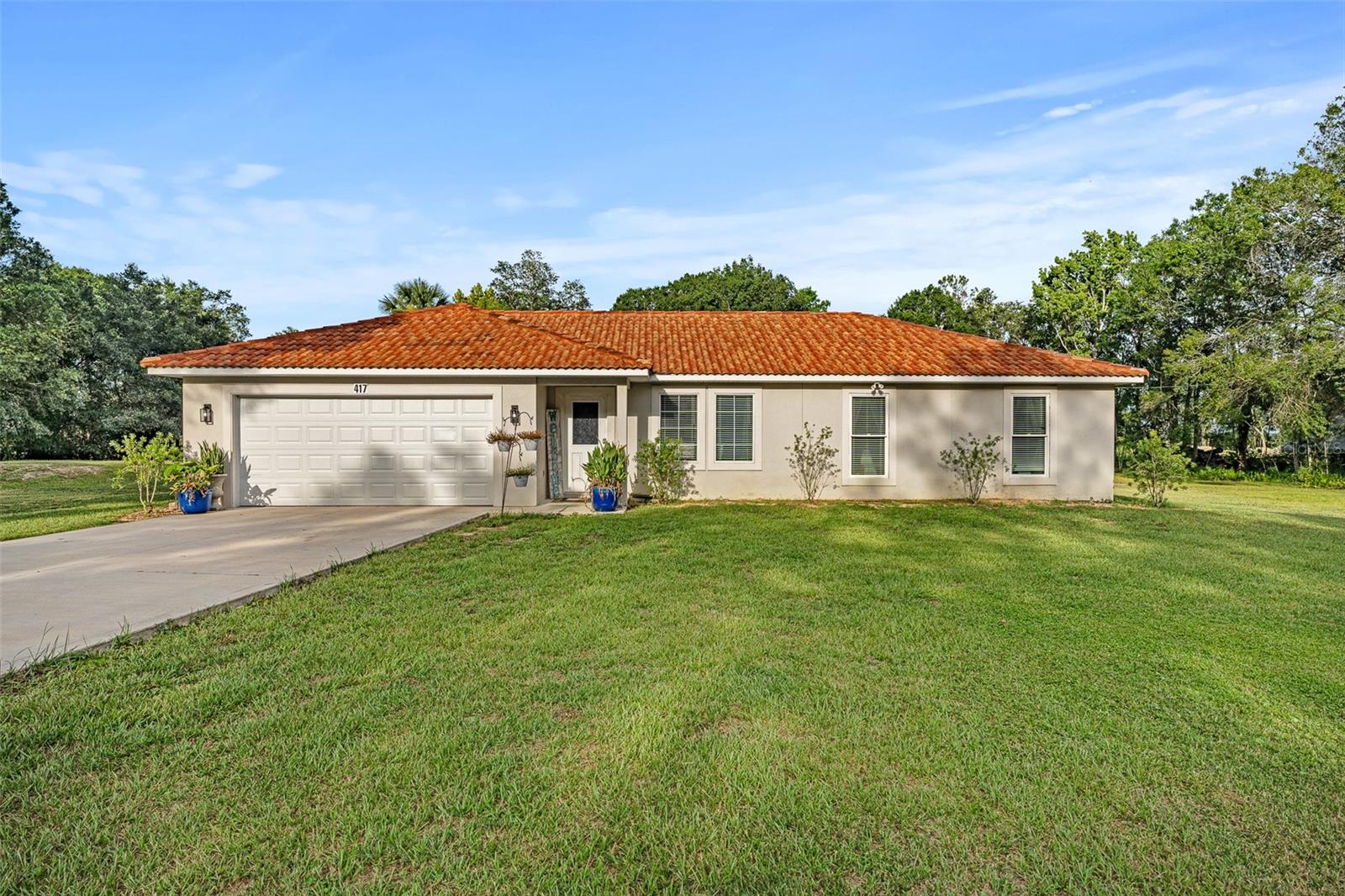 2023 Built Home on 1.25 Acres – No HOA – Tile Roof – RV/Boat Friendly!
Discover peace and flexibility at 417 Garden Ln, Bunnell, FL — a well-maintained 2023-built single-family home nestled on 1.25 cleared acres with no HOA and no restrictions, making it perfect for RVs, boats, equipment, or future additions. Located toward the end of a quiet dead-end street, this property offers the space and freedom many buyers are looking for in Flagler County. Inside, you'll find a light-filled open floor plan with vaulted ceilings, tile flooring throughout, and a seamless flow between the living, dining, and kitchen areas. The kitchen features solid wood cabinets, granite countertops, and ample prep space — ideal for entertaining or everyday life. Enjoy Florida evenings on the large covered lanai, with plenty of room to expand, garden, or install a pool. Additional highlights include an attached 2-car garage and a durable tile roof. The 1.25-acre lot is mostly cleared, providing endless possibilities for customization, outdoor storage, or even a detached workshop.
Whether you're searching for a home with acreage in Bunnell, a modern Florida home with land, or a property with no HOA and RV/Boat parking, this move-in-ready home checks every box. Schedule your showing today and experience the freedom of Garden Ln living!
Special financing with a lender credit to be used for closing costs, and or interest rate buy down. Borrower must qualify for our exclusive financing program.