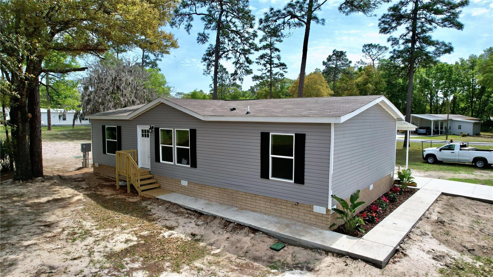 Motivated Seller! Open to Offers! Brand new! Large 3 bedroom, 2 bath home, in sought after Dunnellon Community for ages 55+. Not in Flood Zone! Yes, in this community you own your lot. Located between Crystal River and Dunnellon. Great open floor plan features large family room with accent wall, kitchen has large breakfast bar with sitting, coffee bar, lots of cabinets and stain-less steel appliances. Separate Dining. Oversized master suite offers walk-in closet, double vanity and large shower. Large separate secondary bedrooms. Screened Porch, Carport and shed. This energy smart home has Aron gas low E windows, prewired for solar panels, LED lighting, Hybrid heat pump and water heater, Thermoply structural sheathing. Next Gen insulation, Carrier comfort heat pump and smart thermostat. Community Center has heated pool, club house and shuffleboard. You also have the option to choose a lot and choose a home that will fit your individual needs. Call to schedule appointment today!