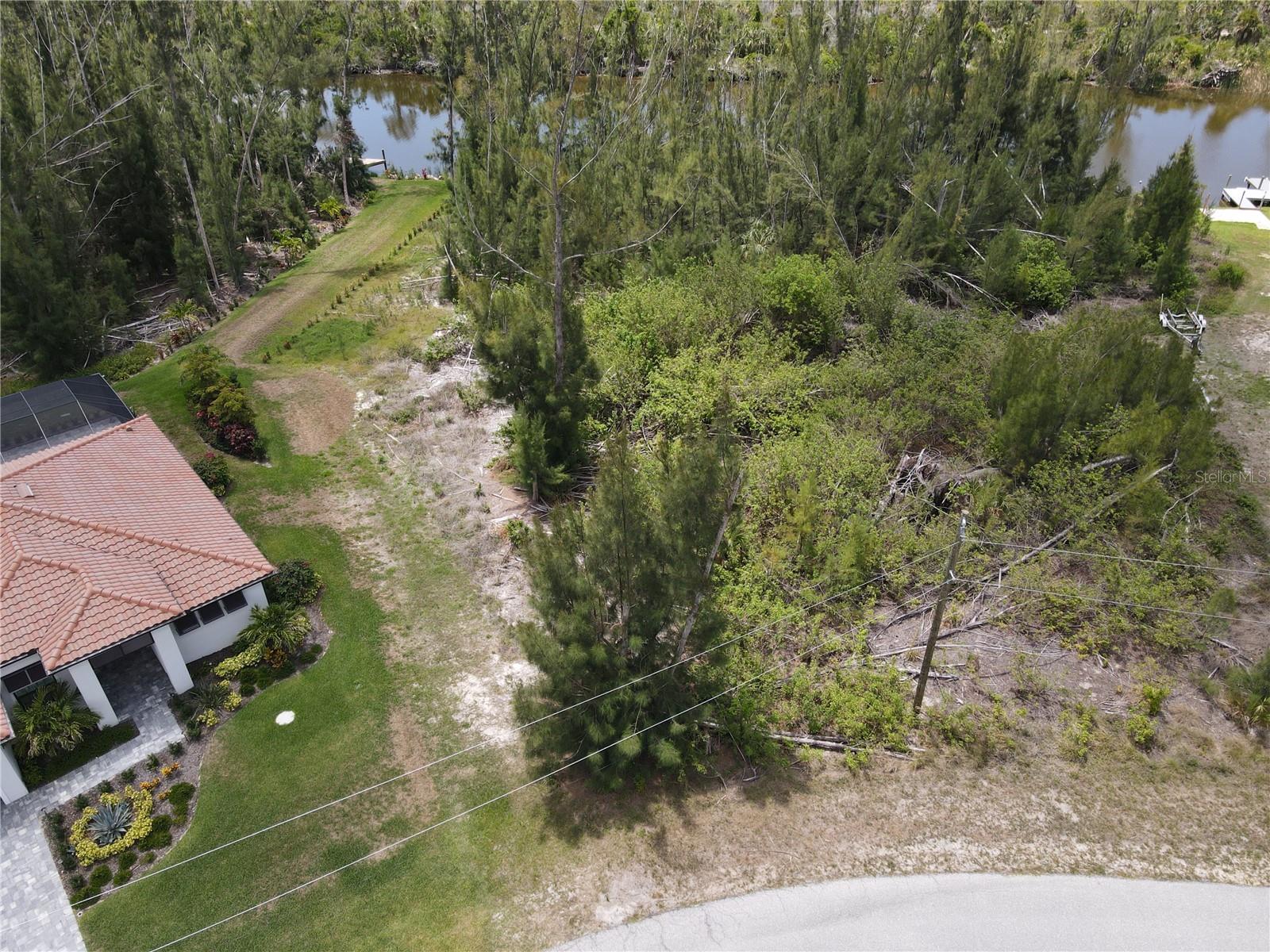 WATERFRONT LOT with SAILBOAT Access – Your Slice of Paradise Awaits! Imagine waking up each day to the serene beauty of the water, and ending your evenings with breathtaking sunsets over the wide SANTA CRUZ Waterway. This exceptional SAILBOAT-access waterfront lot is nestled in the peaceful Waterview Preserve, a deed-restricted community within the desirable SOUTH GULF COVE. Just MINUTES to open waters, Charlotte Harbor and the Gulf of Mexico. With over 11,300 square feet and southern rear exposure, this OVERSIZED lot offers the perfect canvas to bring your dream home to life. All utilities are in place, making the building process that much easier. Here, you’ll enjoy more than just a place to live – you'll be part of a community that values outdoor living and natural beauty. Spend your days boating through 50+ miles of scenic waterways, launching from the community’s public boat ramp. Take the family to one of the local parks or playground, stroll the sidewalks, or tee off at one of the many nearby semi-private golf courses. Just 20 minutes from the beaches of Boca Grande and Manasota Key, and a short drive to shopping and dining. New homes are rising all around as more people discover this hidden gem. Don’t miss your chance to claim your own piece of waterfront!
