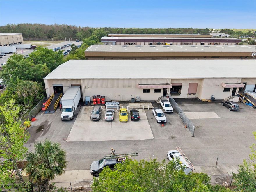 Prime opportunity to acquire a functional industrial warehouse condo in the highly desirable Airport submarket of Orlando—ideal for both investors seeking in-place income and owner-users planning for future occupancy.

This 8,479 SF asset (±646 SF office / ±7,786 SF warehouse) is currently leased to a national telecommunications infrastructure contractor through September 17, 2026, providing stable cash flow during the near term. The tenant has an established presence at the property, and there is a strong possibility of renewal, while the lease term also offers clear timing for an owner-user to plan occupancy.

The property is currently leased at $11.55/SF, representing a significant discount to market rents ($15–$18/SF), creating a compelling mark-to-market opportunity for investors or the ability for an owner-user to acquire at a basis supported by below-market income.

Constructed of concrete block, the building offers 16–17 ft clear height, two dock-high doors (including one with lift), and a secured fenced/gated configuration, making it highly functional for logistics, distribution, or service-based operations. The office buildout includes a reception area, two private offices, and dual restrooms.

Strategically located with immediate access to Florida Turnpike, SR 528 (Beachline Expressway), and SR 417 (Central Florida GreeneWay), and minutes from Orlando International Airport, the property sits within one of Central Florida’s most active industrial corridors.

This asset provides immediate return with embedded upside, while also presenting a rare opportunity for an owner-user to secure a well-located facility with near-term occupancy optionality.