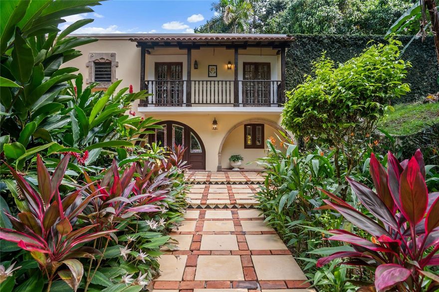 Welcome to 40 Camino Coqui, a magnificent property nestled in the serene locale of Beverly Hills in Guaynabo. This exceptional residence offers a harmonious blend of elegance and comfort, set against the backdrop of stunning landscaped mountain views. With a generous living space of 5,348 square feet, and a 3,856 square meters lot, this home is designed to accommodate both family living and entertaining.

Upon entering, you are greeted by a spacious and inviting foyer that leads to the main living areas. The property boasts three well-appointed bedrooms, a flex room, and a guest suite. The master suite features a bonus room, currently used as a gym and an office. There is a total of three full bathrooms and one half bathroom.

The living room is bathed in natural light, creating a warm and welcoming atmosphere. It seamlessly connects to the dining area, perfect for hosting intimate dinners or larger gatherings. The kitchen is a U-shaped chef's delight, equipped with modern appliances and abundant storage. 

Step outside to discover a lush garden that surrounds the property, offering a serene escape from the hustle and bustle of daily life. The meticulously landscaped grounds are complemented by a sparkling pool, ideal for relaxation and leisure. This tropical retreat provides a unique opportunity to enjoy the beauty of nature in the privacy of your own home.

40 Camino Coqui is more than just a residence; it is a lifestyle. Fully equipped with 20 kW diesel backup power generator, two 500 gal water cisterns, one 200 gal diesel tank, and one 25 gal water filter. The property is situated in a desirable location, offering easy access to top schools, main roads and entertainment. Beverly Hills is gated community of custom-built homes, with 24-hour security.

For more information or to schedule a private viewing, please contact us. Experience the charm and elegance of this remarkable property and envision the possibilities it holds for your future.