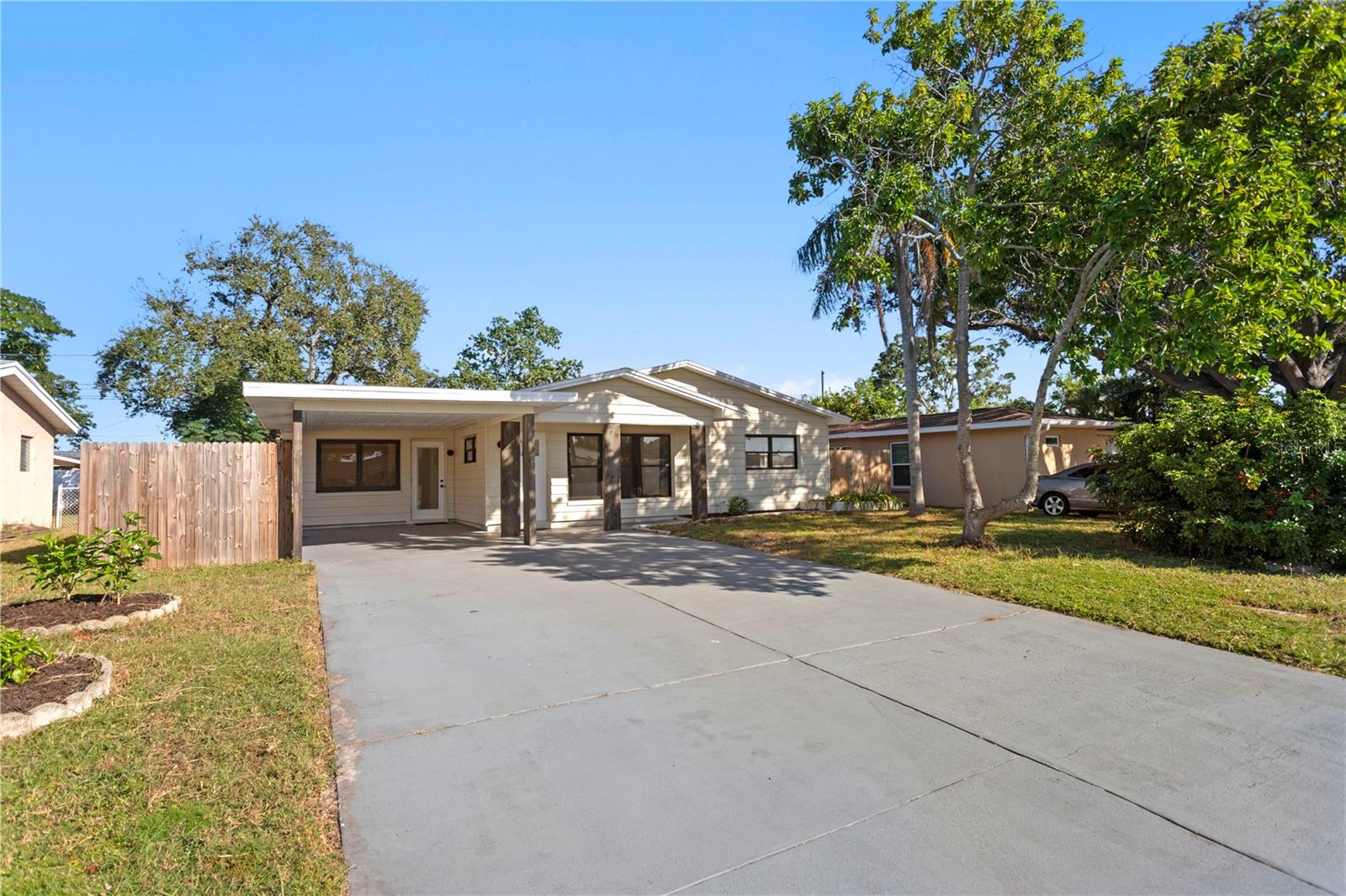 Prime Seminole Location. Updated and Move-In Ready! Perfectly situated near Seminole City Center, Seminole Recreation Center, and Largo Mall, this beautifully updated concrete block home (covered with siding) offers easy living in a high-and-dry, non-flood zone neighborhood. Freshly painted inside and out, the home features new flooring, a brand-new roof, updated electrical, and a modernized kitchen with new appliances and new stylish 1/2 bath. Enjoy a flexible floor plan with three bedrooms, one and a half baths, and a bonus den or office, ideal for working from home or extra guest space. Additional highlights include a 2019 HVAC system, upgraded electrical panel, and plenty of storage throughout. The property offers excellent outdoor space with a large fenced backyard, a spacious front yard, and a carport with ample parking. No rental restrictions make this a fantastic primary home or investment opportunity. Located just minutes to shopping, dining, entertainment, and the Gulf beaches, this home truly delivers comfort, convenience, and value in one of Seminole’s most desirable areas.