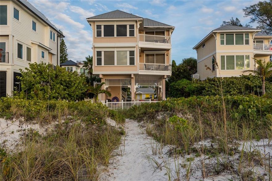 BEST PRICED BEACH FRONT HOME ON ANNA MARIA ISLAND with gorgeous views of the Gulf. This spectacular property offers views of both the beach AND the bay!!!  Downstairs has an open floor plan, high ceilings- gourmet kitchen, living, dining, 1/2 bath and a beach side deck. The three bedrooms are located upstairs.  Master suite & bedroom #2 each beach-side with a shared sundeck. Shady, patio lounge on ground level with fenced in beach-side courtyard. Selling furnished. Parcel located seaward of the CCCL.