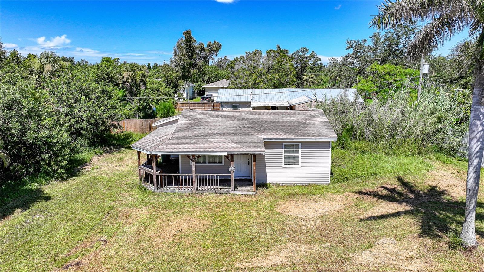 Located in the quiet and established Lake Emma neighborhood of Punta Gorda, 2701 Charlene Street is a charming single-story home that captures the essence of classic Florida living. Built in 1958, this cozy 2-bedroom, 1-bathroom residence offers a simple yet functional layout with approximately 707 square feet of living space. The interior features durable tile flooring throughout, providing a clean and low-maintenance environment that’s ideal for a variety of lifestyles. The home sits on a generous 8,000 square foot lot, with a traditional wood-frame construction and vinyl siding that reflect its mid-century character. A quaint covered front porch welcomes you into the home and offers a relaxing space to enjoy quiet mornings or evening breezes. Positioned on the north side of Charlene Street, the home faces north and is nestled within a peaceful, residential area. Central heating and cooling ensure comfort throughout the year, while public water service and a private septic system offer convenience without the added cost of city sewer. With no HOA fees and close proximity to downtown Punta Gorda, local parks, shops, and waterfront amenities, this home presents an excellent opportunity for first-time buyers, seasonal residents, or anyone seeking a comfortable, affordable property in a well-located neighborhood.