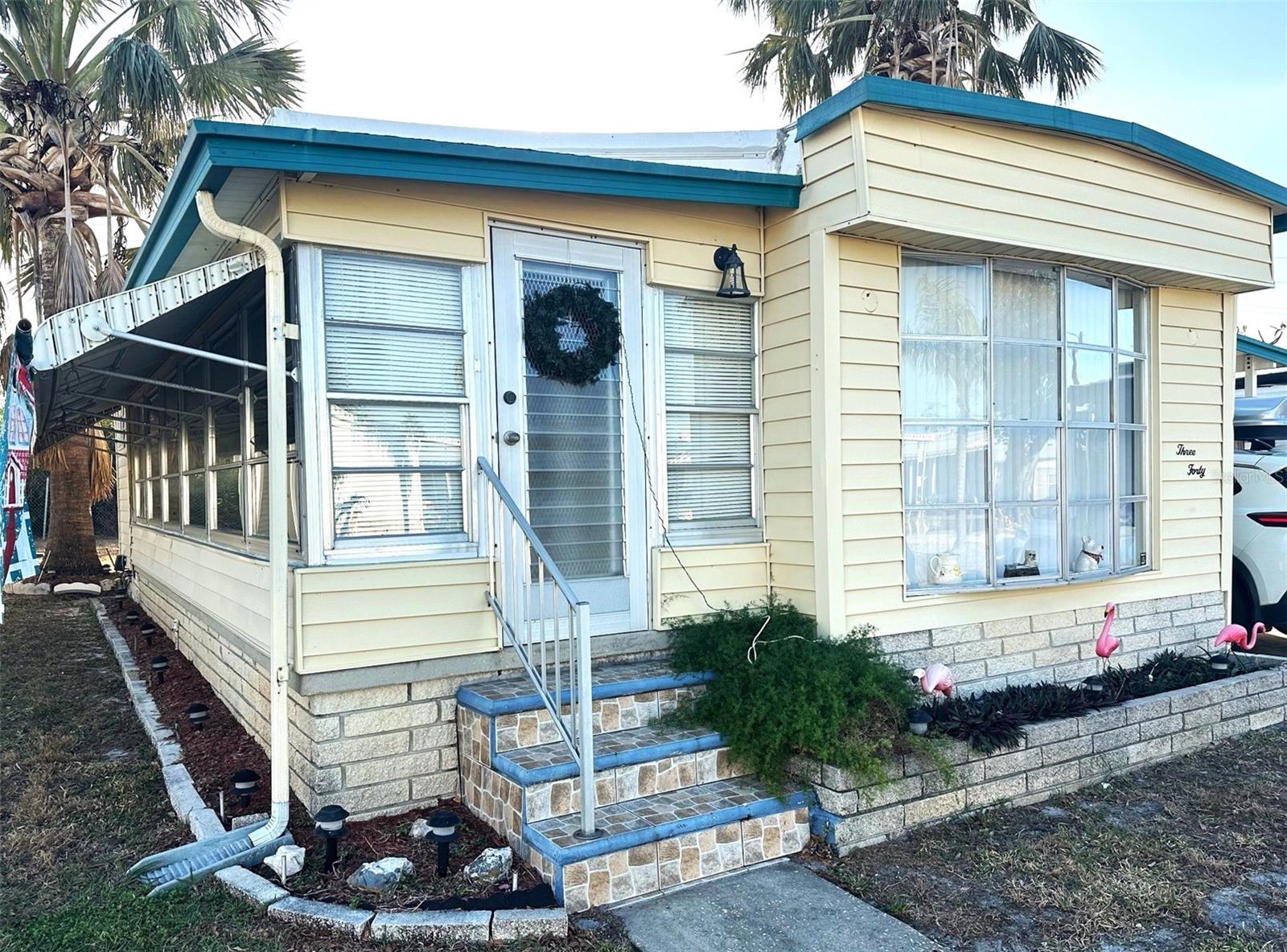 New Price! Hurry to see this Lovely 2 bed/1 1/2 bath, 968 sq. ft. Pristine Home, with additional sunny 10x20 Florida Room to enjoy! Updated Central Air/Heat '20, & Water Heater '21. Insulated Double Roof Over & Vinyl Siding! Beautiful Laminate floors, fully furnished and ready to move in! So many extras to see! Open spacious floor plan & inviting kitchen, to help with all your entertaining!  Located on the desired perimeter, with a wonderful private back yard patio! Large 10x10 Workshop/Shed, with convenient Washer/Dryer! Covered parking for 2+ cars! Cash only! Asking $112,900., includes the Share! Low $331. mo. fee, covers your water, sewer, garbage, internet & cable tv. Say Hello to this 5 Star, 55+, Active new lifestyle in the Spectacular Clearwater Cascade Community! 2 large pools, hot tub, gym, security, kayak/canoe ramp, and lots of fun activities! Small pet ok! Close to beaches, shopping, golf courses, VA medical, airports, and all you would want!