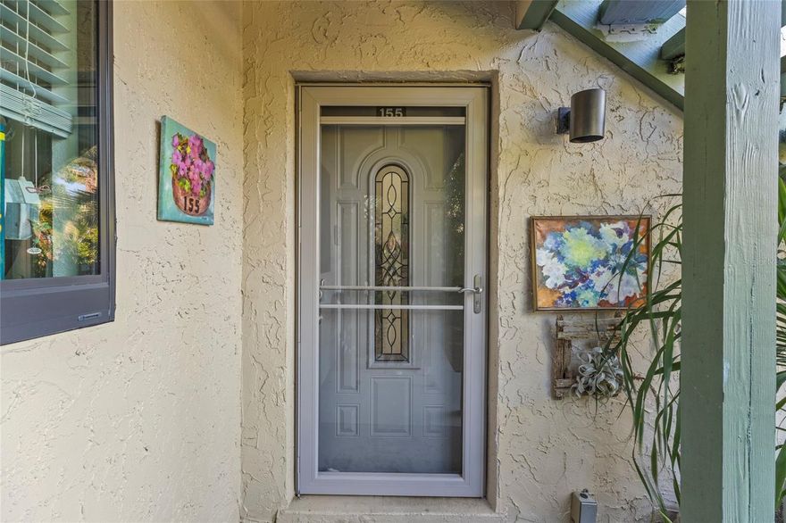 This one-bedroom ground floor condominium has stunning views of Sarasota Bay and is nestled under a canopy of oak trees with storybook views.  The open floor plan with the sunny & bright Florida lanai room boasts loads of storage in and out.  This condo is centrally located within Pelican Cove, one of Sarasota's most popular gated, waterfront complexes. The open kitchen has been renovated to make a more open flow and easy living or entertaining.  The fence enclosed courtyard, off the primary bedroom, is a wonderful spot any time of the day.  It's a short walk from the front door to the most picturesque of the six heated pools, or to the serene deck at Pelican Point to watch the sun set over the bay.  Pelican Cove is spread out over 75 acres of natural beauty, built along Sarasota Bay. Pelican Cove has to be seen to be appreciated with manicured tropical foliage, tennis courts, 6 pools, exercise room and workshops of all kinds. Activities of every type are present: Art, Music, Wood working, Boating, and Fitness & Pelican University, kayaking, fishing, 6 pools, 4 tennis courts, a private harbor and numerous clubs and activities. Additional storage has been added to this condo for new owners' convenience. Pelican Cove is spread over 75 acres and amenities include/gated community of botanical setting on Little Sarasota Bay, within a gated community that offers sailboat, canoe, kayaking & fishing 6 pools, 4 tennis courts, a private harbor and numerous clubs and activities.  This condo comes with an outdoor storage shed.