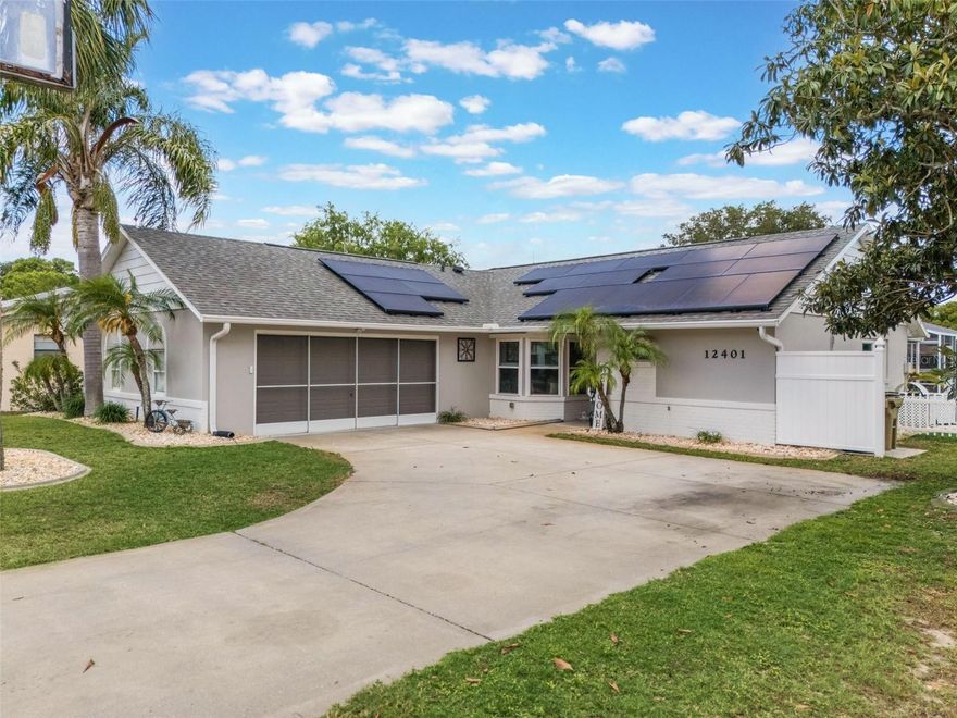 Experience waterfront living on a peaceful canal leading directly to Lake Eustis, complete with a private dock and boat lift for effortless days on the water. This bright, sun-filled home showcases spa shower and huge walk-in closet, custom moldings, new windows, elegant ceiling fans, and thoughtful upgrades throughout. The updated kitchen and custom closet organizers add both style and function, while an attic with additional storage provides extra convenience. Major systems—including the roof, hot water heater, and AC—have all been replaced within the past five years for peace of mind. Step outside to your enclosed pool and lanai, creating a private retreat perfect for relaxing or entertaining while enjoying tranquil water views. With its charming character, updated finishes, and serene setting, this home offers the perfect blend of comfort and luxury. Seller is offering $30,000 in concessions that may be used toward paying off the solar in it's entirety or to help buy down the buyer’s interest rate.