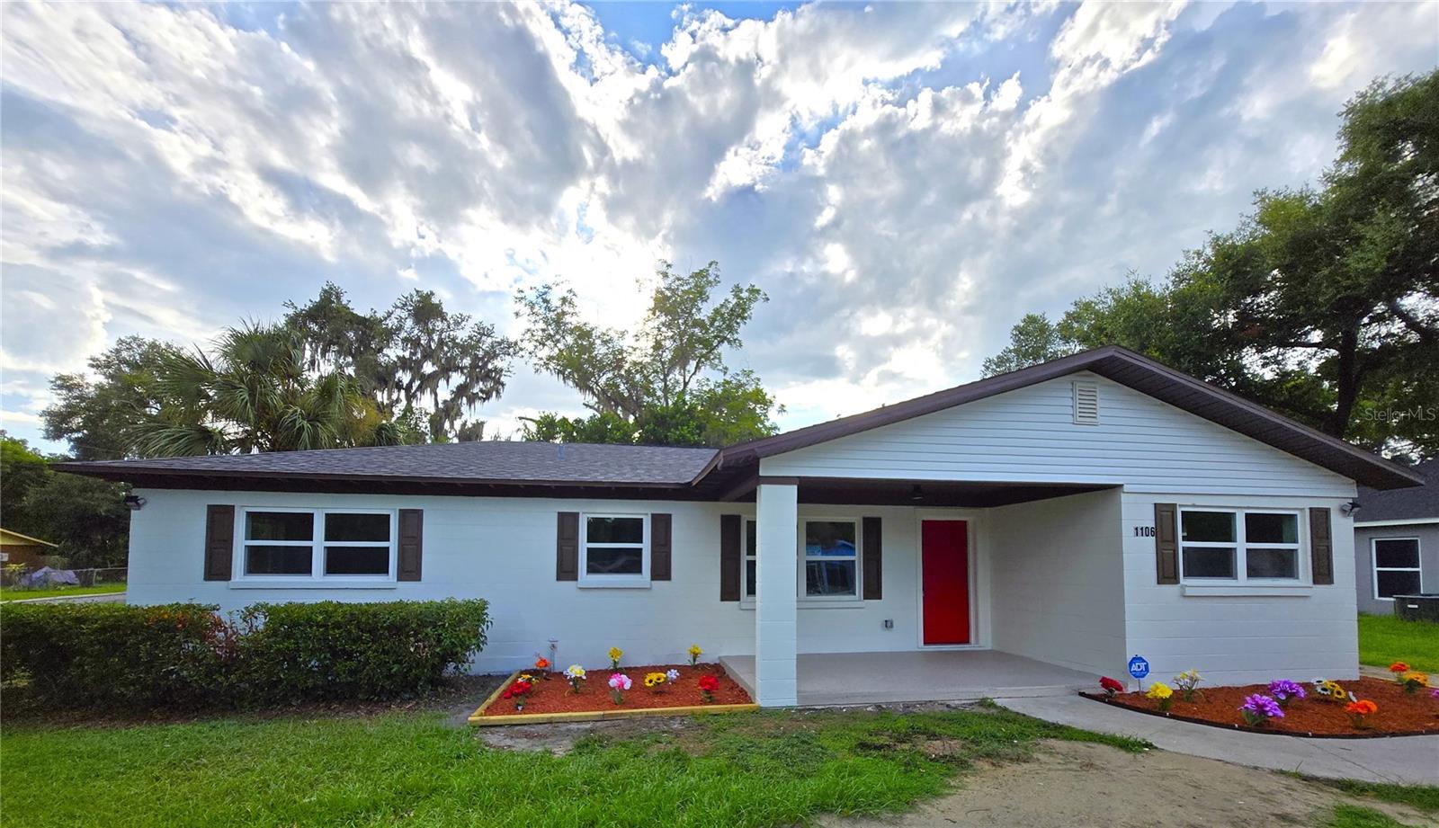Welcome to 1106 N Crestview Ave—Lakeland living, fully reimagined. This light and bright 4-bedroom, 2-bath home sits on a spacious corner lot and has been completely renovated inside and out with high-end upgrades throughout. Nearly everything is brand new—from the major systems to the designer touches—and it's ready for you to move in and enjoy.
You'll love the stylish luxury vinyl plank flooring throughout the main living areas and bedrooms, paired with new ceiling fans in every room for comfort and efficiency. The home features double-panel interior doors, modern light fixtures throughout, and fresh interior and exterior paint—right down to the new decorative shutters and even the mailbox.
The kitchen is a true showpiece with stainless steel GE appliances, subway tile backsplash, double-bowl sink, and beautiful cabinetry—all underlined by tons of natural light streaming through updated windows. Just off the kitchen, you’ll find a convenient laundry closet perfectly sized for a stackable washer and dryer, making household chores a breeze.
The primary suite is extra large and features double closets, a sliding barn door bathroom entry, and a beautifully newly added en-suite bathroom with a walk-in shower and elegant marble-look porcelain tile flooring. The second bathroom echoes the same upscale finish for a consistent, luxurious feel.
Step outside and enjoy your covered front porch with a ceiling fan—perfect for sipping your morning coffee or unwinding in the evening. The yard features fresh mulch in the front beds, a new red front door for that perfect pop of curb appeal, and architectural shingles on the roof (replaced within the last 2 years). You'll also appreciate the new metal soffits, new HVAC, new windows, and updated plumbing, electrical, and sewer line.
The large corner lot offers plenty of room to add a pool, fence in the yard, or park your boat, RV, or extra vehicles with ease thanks to a spacious multi-car driveway and side yard access.
Everything’s done—just bring your furniture. Welcome home.
