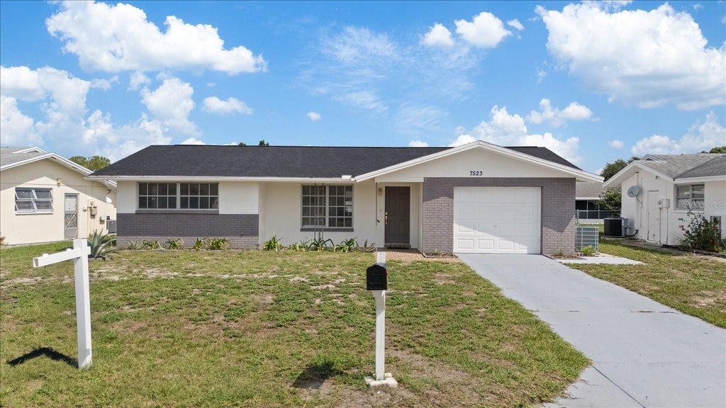 Photo of 7523 Briarwood Drive, Port Richey, FL 34668 (MLS # TB8513124)