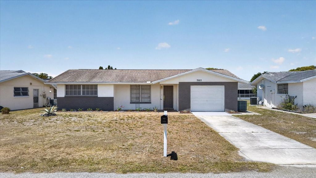 Photo of 7523 Briarwood Drive, Port Richey, FL 34668 (MLS # TB8513124)
