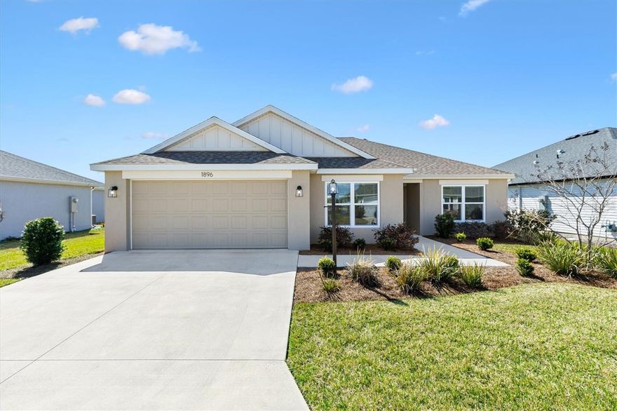 Nearly New 3/2 Eagle Designer concrete block and stucco home located 1 mile from both Eastport Town Center and Downtown Middleton, with easy access to multiple recreation centers and swimming pools nearby. This home, in the Village of Moultrie Creek, offers privacy and peaceful views, with no homes directly in front or behind. 
A covered front porch welcomes you into an open and split floor plan designed for both comfort and functionality. Luxury vinyl plank flooring enhances the main living areas, while the bedrooms feature plush carpet. Window blinds and ceiling fans are thoughtfully placed throughout the home for year-round comfort, while the oversized garage is a roomy home for your vehicles.
The spacious eat-in kitchen is the heart of the home, showcasing stainless steel appliances, a 4-burner gas stove with griddle, quartz countertops, soft-close cabinet doors, a pantry closet, and a convenient breakfast bar. The adjoining dining nook provides tranquil pond views—an ideal setting for morning coffee or relaxed meals.
The master suite offers a large walk-in closet and an ensuite bath with dual quartz top vanities and a Roman walk-in shower with built-in bench. A laundry room with mud sink and additional storage closet is conveniently located near the master bedroom. A pocket door creates privacy for the guest wing, where you’ll find two guest bedrooms and a guest bath with quartz top vanity and tub/shower combination. The front bedroom is accented with a distinctive square coffered ceiling.
Step outside to the screened lanai and adjacent outdoor patio—perfect for grilling and enjoying the fresh air. Additional highlights include being freshly painted and move in ready, Smart Home readiness, knockdown (hand-troweled) ceilings, and a tankless hot water heater. As an added bonus, a nearby fire hydrant may offer potential insurance savings adding to the homes appeal. Gather with friends and neighbors at Moultrie Creek or Saluki Recreation areas, nearby family and adult pools, and enjoy golfing at Shallow Creek Championship golf Course. Brownwood Town Center is just 15 minutes away. Don’t miss your chance to make this tranquil oasis your own. Watch our video and make your appointment to see it today!