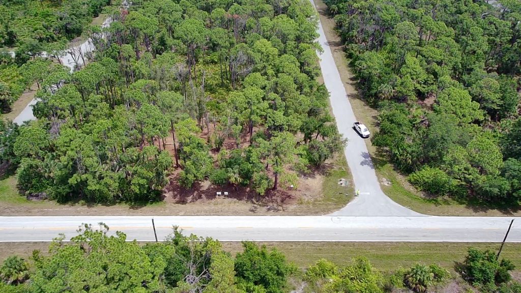 Photo of 13018 Chamberlain Boulevard, Port Charlotte, FL 33953 (MLS # TB8437963)