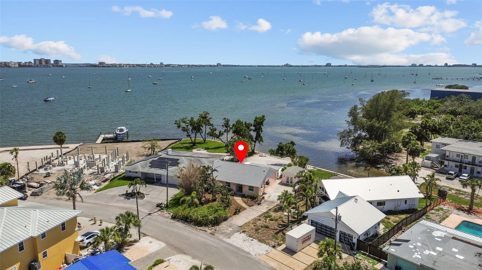 Looking for Waterfront property with 180° Boca Ciega Bay and Intracoastal Views!! Here is it and prepare to Fall in Love with this backyard!
Prepare to be captivated from the moment you step inside this stunning Gulfport residence, where dramatic, panoramic views of the Intracoastal Waterway immediately command your attention. Designed for seamless indoor-outdoor living, the open-concept floor plan is bathed in an abundance of natural light, creating an airy and inviting atmosphere that is both elegant and relaxing.
This 3-bedroom, 2-bathroom home has been meticulously renovated to the highest standards. The heart of the home flows effortlessly to a generous covered patio, your private front-row seat to Florida's famed sunsets! Imagine ending your day with a cool drink in hand, overlooking the glistening pool as boats drift by and the sky puts on its nightly stunning show—a view that will never grow old.
Peace of mind is assured with significant recent upgrades, including a New HVAC, a suite of New kitchen appliances, New interior doors, New water heater, New pool pump and New washer & dryer. The Newer roof and windows are only three years old. The property’s exterior is just as impressive, featuring a Newer seawall and a private 10x20 dock perfect for fishing, sunbathing, or simply launching your next aquatic adventure.
A unique highlight of this property is the versatile, detached building. Envision it as your personal art studio, a state-of-the-art gym, a tranquil greenhouse, or a secure garage for your vehicle and water toys.
The location is, undeniably, perfect. Situated just a stone's throw from the Gulfport Marina, you are only a short walk or bike ride away from the vibrant downtown district's acclaimed restaurants, charming shops, and lively arts scene. This is more than a home; it is a lifestyle of leisure and coastal elegance, waiting for you to make it your own Sanctuary with a Million dollar view!