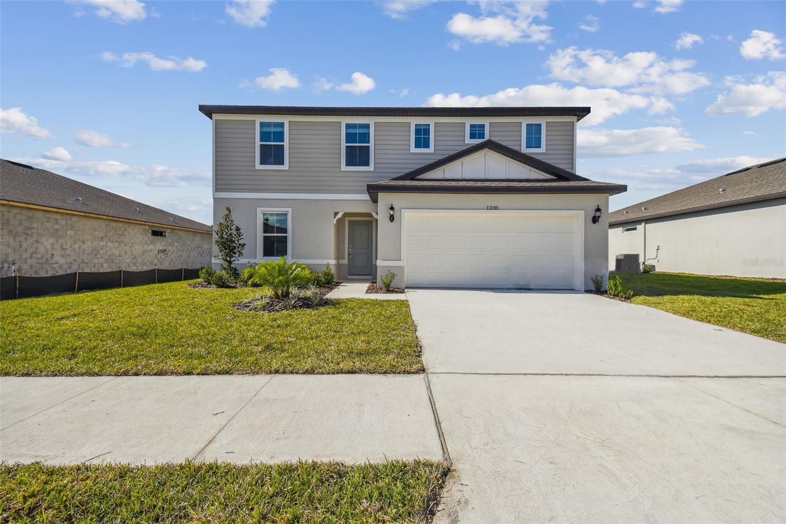 New Construction Available Now with NO CDD Fees! You can close this year on this lovely Thompson Quick Move-In Home in the boutique community Estates of Lake Florence. This two-story Thompson offers an open-concept floor plan with a spacious kitchen, dining and gathering room that lead to sliders onto the huge covered lanai. This home features beautiful white cabinets, 3cm majestic white granite countertops through the kitchen and bathrooms, plus stainless steel appliances including refrigerator, range, microwave and washer/dryer. On the first floor you will find a half bath and enclosed flex room which makes an ideal office space. The laundry room is efficiently located on the second floor as well as a loft, four bedrooms and two bathrooms. Call or Stop by Today and ask us about our current incentives!