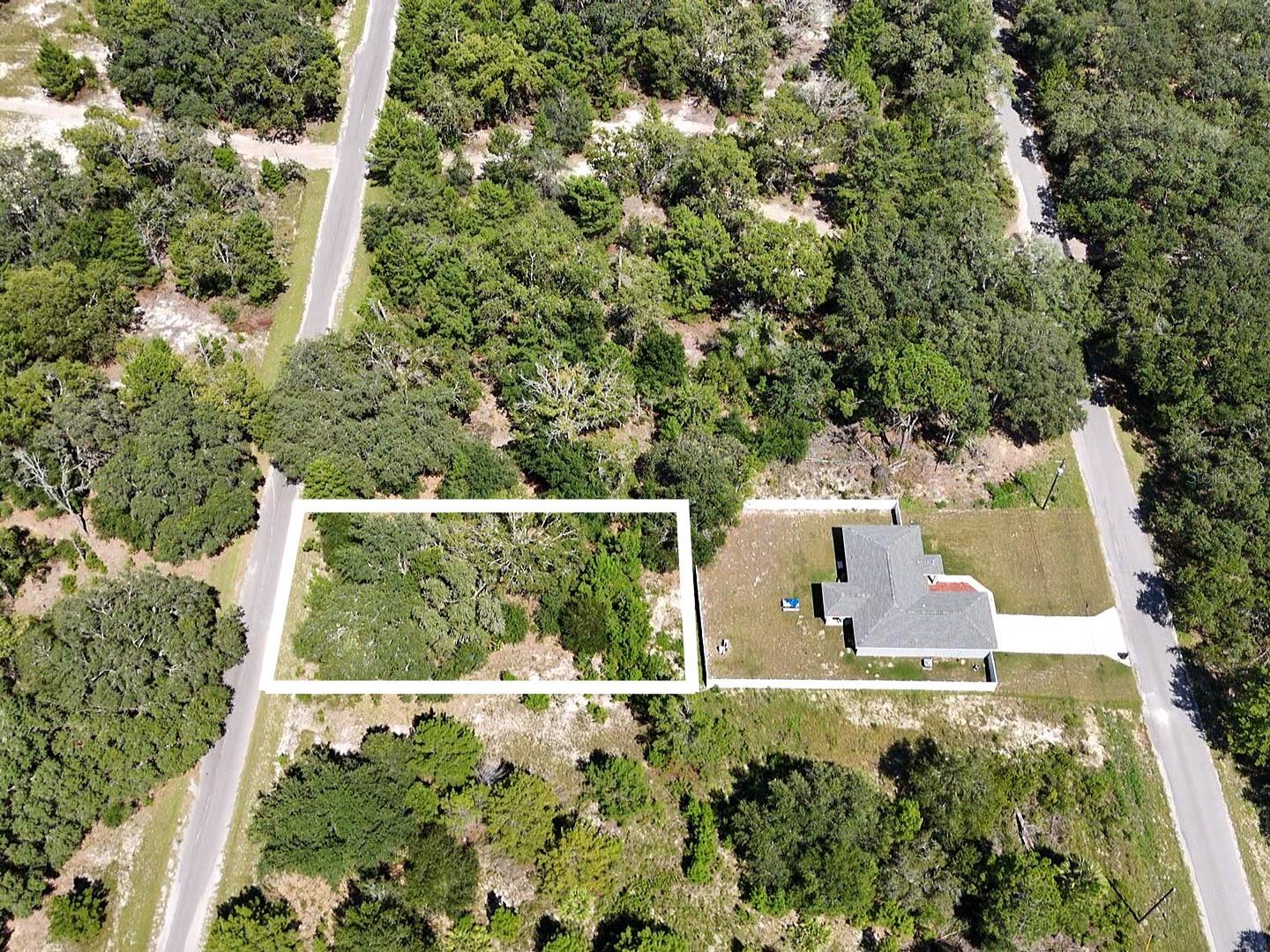 Discover the perfect opportunity to build your dream home on this 0.26-acre residential lot located on a quiet paved asphalt road in the heart of Silver Springs Shores, Ocklawaha. Offering 80 feet of frontage and 140 feet of depth, this level parcel features light natural vegetation, direct road access, and electric utilities nearby. Zoned R1. Single Family Dwelling, this lot has no HOA and is surrounded by natural beauty and growing residential development. Whether you're a homeowner or investor, this site is ideal for a primary residence, vacation build, or long-term land hold. Priced to sell don't miss this exceptional land opportunity in Marion County!