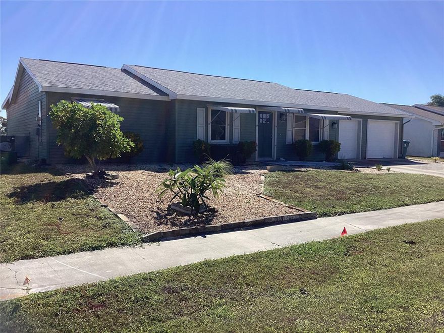 FRESH WATER, CANAL FRONT REMODELED 2 BR, 2 BA ADORABLE HOME WITH A LARGE (21'8" x 27'4") TWO CAR GARAGE. You walk into the front living room with all new vinyl plank flooring and a ceiling fan. You will notice plenty of cabinets in the hall for storage and a separate laundry room with a washer and dryer, a folding table and more storage. When you pass to the back of the house you see the huge, remodeled area (34' 11" X 15 '6") which features a beautiful kitchen as the central point, a family room area on one side and a dining room area on the other. There are vinyl floors, new ceiling fans, lighting, new windows and sliders. The kitchen features slow close, shaker cabinets, granite counters and stainless-steel appliances. The Primary BR has its own remodeled bathroom, and the second BR has storage and a walk-in closet. The hall bathroom has also been beautifully remodeled. There is a special condition on this purchase as there are two open permits that have to be addressed by the buyer.