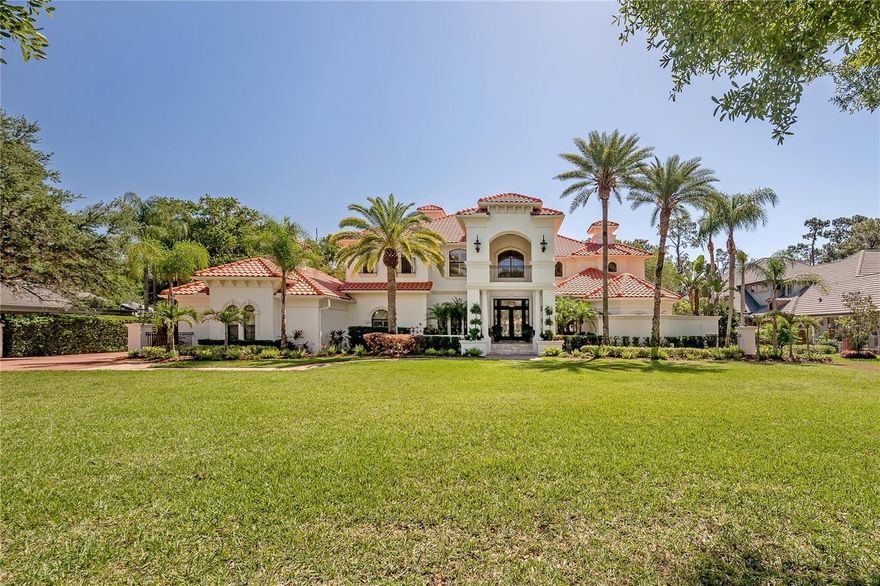 Under contract-accepting backup offers. Welcome to your dream home in the luxurious Keystone Shores, where exclusivity meets tranquility. Beautiful large conservation lots, and only 36 homes comprises this gated community providing the utmost privacy and serenity. This stunning home has an exceptional design that blends modern elegance and comfort. Nestled on a prime 1.49 acre lot, this immaculate property boasts breathtaking views of the sparkling James Lake and lush, verdant surroundings. As you enter through the foyer, you are immediately greeted with an abundance of natural light that illuminates the open-concept living area. The living room features a one of a kind dome with soaring ceilings, adding an impressive architectural element to the space, while the floor to ceiling travertine fireplace serves as a stunning focal point. The home also features an elegant formal dining room, perfect for hosting special occasions or intimate dinner parties. With its thoughtfully designed features, the kitchen is sure to meet all of your cooking needs.It is a culinary oasis, perfect for anyone who loves to cook or entertain with a double slab quartzite island, Subzero refrigerator, Wolf range and an extra large hidden walk-in pantry. The kitchen opens up to a beautiful family room and separate breakfast nook, providing the perfect space for entertaining guests or spending time with loved ones. Two master suites, the primary is on the main floor and is the ultimate retreat, with a sitting area, a large walk-in closet, and en suite spa-like bathroom complete with a jetted soaking tub and a separate walk-through shower, separate vanity sinks, toilet closet and linen closet. The second primary suite is on the second floor and includes a large walk-in closet, a luxurious en suite bathroom with a jetted soaking tub, walk-in shower and separate toilet closet.  The additional bedrooms are all en suites with walk- in closets, providing ample space and privacy for everyone in the home. Off of the formal living room is an elegant home office, providing the perfect space for those who work from home with custom built-ins and a hand crafted coffered ceiling. Whether you're a fitness enthusiast or simply enjoy staying active, there is a private home gym with an en suite bathroom; located just off the oversized 3 car garage and next to the larger downstairs laundry room. The second-floor boasts an ornate custom designed wrought-iron railing that overlooks the formal living room, providing stunning views of the impressive dome ceiling and floor-to-ceiling fireplace. A perfect space for movie or game nights with friends and family, is a large media/game room, also located on the second floor with an en suite bathroom and a balcony overlooking the pool area, picturesque yard and soothing lake. With two laundry rooms, the larger main laundry room on the first floor and the second located on the second floor, allowing convenience always at your fingertips. Outdoor living is equally as impressive, with a sparkling heated salt water swimming pool and spa, and an outdoor kitchen adding to the overall luxury and functionality of the home. With its impressive size and stunning design features, this luxurious home is sure to impress even the most discerning buyer. Keystone Shores offers a playground, tennis and basketball courts, a community dock overlooking Little Lake and is located in the Steinbrenner School District. You won’t want to miss this spectacular estate.