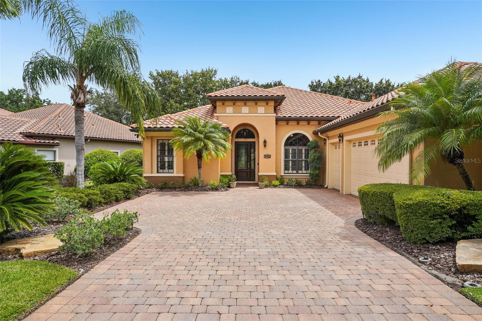 Discover timeless elegance and resort-style living at 9433 San Miguel Ct, nestled in the Las Colinas neighborhood within the Mission Resort & Club in scenic Lake County, Florida.
Surrounded by lush gardens, northern fairway views, and enchanting wildlife, this meticulously maintained home offers the perfect blend of luxury, comfort, relaxation and privacy.
Boasting 2,150 sq ft of thoughtfully designed living space, this residence features high triple tray ceilings, stone tile flooring, and rich wood floors in the bedrooms.
The kitchen is a Chefs dream come true, complete with matching Bosch appliances, a Sub-Zero refrigerator, elegant cabinetry, and modern hardware throughout.
Enjoy memorable gatherings in the formal dining room, or relax in style with upgraded systems that include a Carrier HVAC (2020), hot water heater (2019), and a Generic whole-house generator (2022).
The formal living room is a showstopper with its massive stone fireplace and double French doors that open to an expansive lanai—ideal for entertaining and embracing the Florida lifestyle.
One of the most impressive features?
The Lanai is a dream paradise for those warm summer evenings with designer ceiling fans, and coffered Cedar shiplap ceilings for an upscale design and durability.
Add a stone gas fire pit, plenty of room, and add to that a hydro spa/ pool with new equipment to keep your spa clean and pristine.
Entertainment is complete on the spacious Lanai with a wet bar, wine fridge, and grill area. Outside is a fenced back yard and gate with plenty of room for your pets.
To finish off this home, an oversized, under-air, 600+ sq. ft. garage—perfect for a workshop, storage, and your approved Mission Resort golf cart.
Life at Mission Resort & Club
Located amidst the rolling hills and glistening lakes of Central Florida, Mission Resort & Club offers a rare lifestyle filled with recreation, relaxation, and refined charm. The community features:
• Two championship golf courses
• Four pickleball courts
• All-weather tennis and beach tennis facilities
• Hydro spa and full-service fitness center
• Hotel with pool, hot tub, and three on-site restaurants
Centrally located, you’re just minutes from theme parks, boutique shopping, local wineries, and more—offering both tranquility and accessibility. Golf or Social Membership is required, granting residents full access to the resort’s premier amenities and enhancing the luxury living experience.