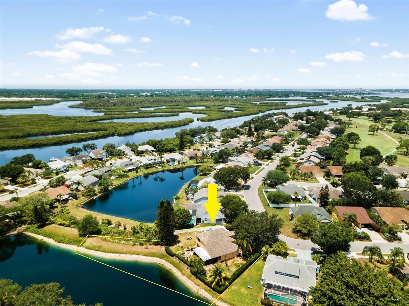 Available starting 9/1/2025 for an annual lease and/or multi-year lease. Non-Furnished. Located in the highly desirable waterfront community of Braden River Lakes and nestled on an oversized lot overlooking the sparkling lake, this two-story, 4-bedroom, 2.5-bath home is ready for you to make memories in. Elegantly refined, this home boasts irresistible curb appeal featuring a 2-car garage with a 3rd car paved driveway for your parking convenience, mature landscaping enhanced with professional nighttime lighting, a dramatic front porch with double front doors, and stunning French windows that highlight the façade. As you come in, you will be greeted by an open floor plan and gorgeous marble tiled floors with casual and formal living/dining rooms perfect for family gatherings and entertainment. The soaring ceilings make it bright and airy, complemented by 6-inch baseboards, crown molding throughout, and tasteful light chandeliers highlighting the main rooms. Enjoy a completely remodeled gourmet kitchen designed with Brazilian gold granite countertops, a beautiful tile backsplash, ample cabinet space, and stainless steel appliances. The master bedroom on the first floor has a walk-in closet and a dream master bath equipped with a jetted tub and designer vanity. Upstairs are the other three spacious bedrooms and a remodeled bathroom. Cozy up in your expansive lanai, screened and finished with beautiful tile plank floors, perfect for indoor/outdoor living. Or bask under the sun (or stars) in your yard or paved patio with a stone fire pit and enjoy the amazing 180-degree water views of the lake and the tropical ambiance of the oak trees, giant pine trees, and fruit trees, including avocados, limes, grapefruit, oranges, and coconuts. This home also includes CCTV and exterior security cameras with a monitor and smart home features such as a Yale smart lock, Nest doorbell, smart thermostat, smart light switches for interior, patio, and landscaping lights, and a smart garage door opener. Additionally, it includes six zones of automatic irrigation and more. Centrally located in a quiet community where all the amenities overlook the water, you can even spot dolphins and manatees right from the community area! Amenities include a community pool, volleyball and tennis courts, a kayak launching station, playgrounds, gazebos, community BBQ grills, and much more! Close to all essentials, including dining, banks, and popular shopping destinations such as Publix, Walmart, Costco, Home Depot, and more. Only 5 minutes away from the public boat ramp and 20 minutes away from the sandy beaches of Anna Maria Island! *Hot tub in pictures and playground do not stay in the house*