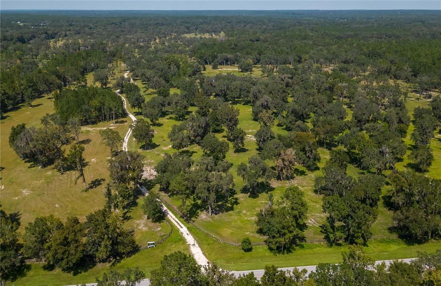 Providing over 178 acres, this stunning countryside parcel is perfect for horses! Zoned A-1, the property is loaded with big, beautiful oaks that provide gentle shade. 4 ponds are on the property. This is a wonderful opportunity for those looking to develop a large horse farm facility. Located with paved road frontage on both County Road 316 and NW 160th Street, the property provides ample opportunity. Conveniently located within Marion County’s horse country, this parcel is just 15 minutes from HITS and about 25 minutes from the World Equestrian Center. Closer to the property is the Ocala Jockey Club, which was recently acquired by the World Equestrian Center, Majestic Oaks, and Sweet Dixie South– all of which are within 10-20 minutes of the property for added equestrian opportunities!
