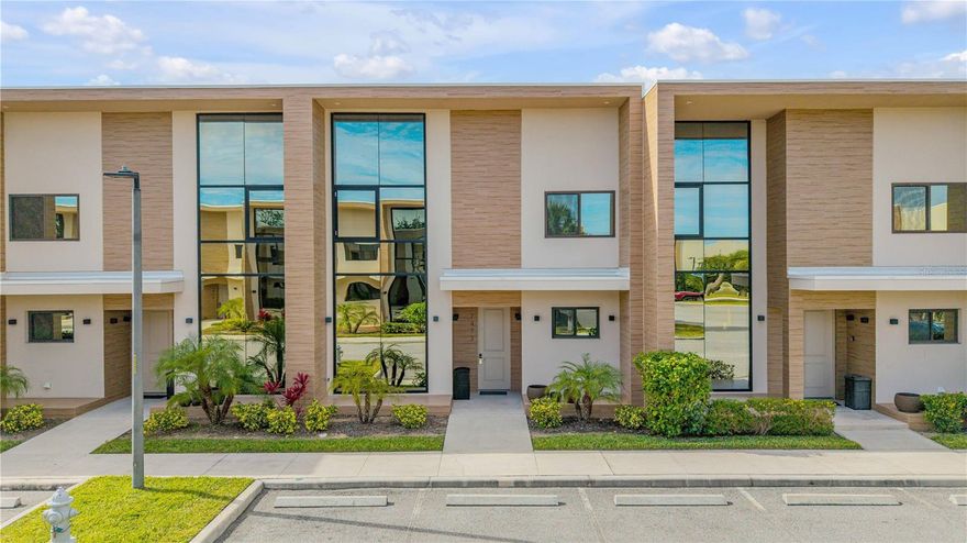 Welcome to 7473 Brooklyn Dr, a fully furnished, turnkey luxury townhome in the sought-after, gated Magic Village Views resort community in Kissimmee, Florida. This exceptional 4-bedroom, 4.5-bath residence offers the ultimate blend of modern elegance, resort-style amenities, and unbeatable proximity to the magic of Walt Disney World—just 5 minutes away. Whether you’re seeking a high-yield short-term rental investment, a prime Airbnb opportunity, or a sophisticated vacation home to enjoy with family and friends, this property checks every box for luxury, convenience, and income potential.

Step inside to discover a bright, open-concept layout filled with natural light, soaring ceilings, and contemporary design touches throughout. The gourmet kitchen is a chef’s dream, featuring sleek wood cabinetry, premium stainless steel appliances, a generous island with ample seating, and designer lighting—perfect for hosting gatherings or preparing family meals. The expansive living area boasts a statement feature wall with a modern fireplace and mounted TV, plush sectional seating, and seamless flow to the outdoor living space.

The private backyard oasis is a true standout, designed for both relaxation and entertaining. Enjoy a covered patio with a built-in granite summer kitchen, stainless steel grill, sink, and beverage fridge, as well as multiple lounge and dining areas with stylish wicker seating and a private hot tub. Unwind in the evenings while taking in nightly views of Disney’s spectacular fireworks right from your patio—a magical touch few properties can offer.

Retreat to the luxurious primary suite, which features plush carpeting, large windows with tranquil views, custom lighting, a king-size bed, and a spa-inspired ensuite bath with walk-in shower and dual vanities. Each additional bedroom is thoughtfully appointed for comfort and privacy, with modern furnishings and private bathrooms, making this home ideal for families, groups, or vacation guests.

Magic Village Views delivers an unparalleled resort lifestyle with an array of amenities: 24-hour gated security, a stunning lobby with lush greenery and unique decor, a business center, a state-of-the-art fitness center, a sparkling resort-style pool with ample sun loungers, a playground, tennis courts, sand volleyball, giant outdoor chess, and on-site restaurant and lounge. The community’s beautifully landscaped grounds and social spaces offer endless opportunities for recreation, relaxation, and connection.

Location is everything, and this property places you at the heart of Central Florida’s world-class attractions. In addition to being less than 2 miles from Disney Parks, you’re just minutes from Universal Orlando, Disney Springs, championship golf, premium shopping, and renowned dining. The area’s booming tourism market ensures high demand for short-term rentals and Airbnb stays, making this home a top performer for investors seeking strong occupancy and returns.

This townhome is offered fully furnished and turnkey—simply bring your suitcase and start enjoying or renting immediately. With professional management options available, ownership is truly effortless. Whether you want a magical getaway for your own family or a high-demand income property, 7473 Brooklyn Dr delivers on every level. Experience the best of luxury, location, and investment potential in one extraordinary package—schedule your private tour today and make your Disney dreams a reality!