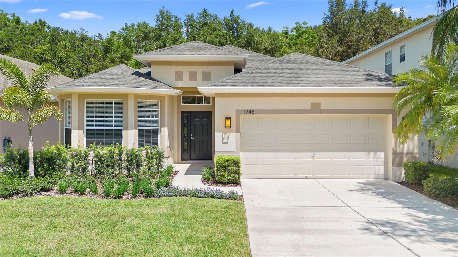 Welcome to this beautifully transformed residence offering 4 spacious bedrooms, 2.5 bathrooms, and over 2100 square feet of refined living space. From the moment you arrive, you'll appreciate the attention to detail and care that have gone into making this home move-in ready. Step inside and be greeted by a bright, open-concept floor plan featuring brand new luxury flooring throughout and 24x48 tile in all bathrooms. The living areas are freshly painted in contemporary tones that complement the abundant natural light. At the heart of the home, the stunning fully remodeled kitchen boasts a large island with oversized sink and breakfast bar overlooking the gathering room. The brand-new cabinetry offers ample storage with 42” Shaker upper cabinets, sleek granite countertops with backsplash, brand new GE Stainless Steel appliances makes this kitchen perfect for everyday living or entertaining guests. All bathrooms have been updated with modern tile flooring and decorative shower finishes, new cabinetry, granite tops, fixtures, and lighted mirrors for a modern touch. Door hardware has been replaced with chrome hinges and sleek chrome handles. Brand new window treatments throughout, new ceiling fans in each room and brand-new lighting to add the final touches. The laundry room features 42” upper cabinets for storage and brand-new full-size, GE washer and dryer. There is a plumbing rough-in located in the garage for the addition of a utility sink. Exterior paint completed end of 2024, Roof replaced in 2023 for worry-free ownership, HVAC System installed in 2022 to keep you comfortable year-round. Outside, enjoy the private backyard that backs to a creek that you can view from the covered lanai and newly landscaped yard—ideal for relaxing, gardening, or hosting gatherings. The serene view from the front door features no home across the street. This exceptional home combines modern style, peace of mind, and space to grow—all in an appealing neighborhood conveniently located to shopping, restaurants, recreation and expressway/major roads. Don’t miss your opportunity to own a fully renovated, turnkey property that feels brand new inside and out! Schedule your private showing today and discover the lifestyle you’ve been waiting for! More pictures coming soon.