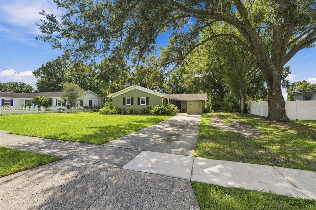 Photo of 6613 Travis Boulevard, Tampa, FL 33610 (MLS # TB8549568)
