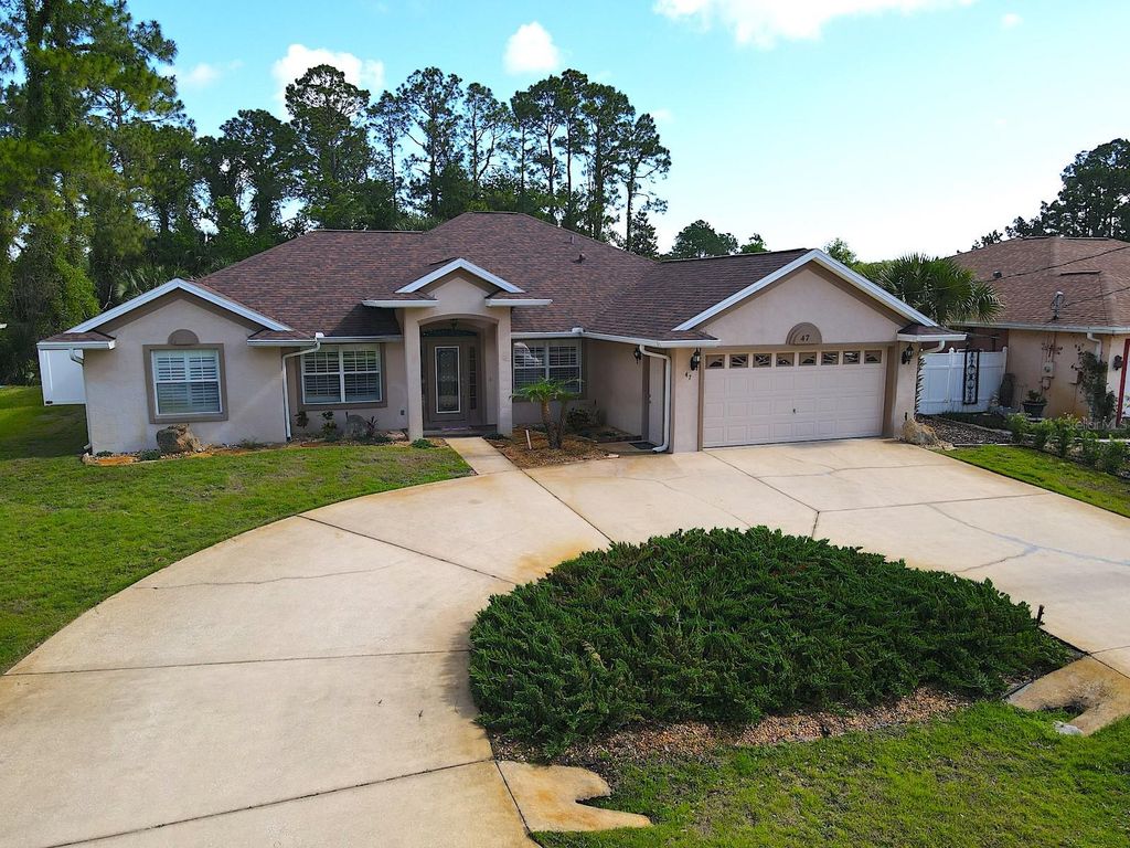 Photo of 47 Pheasant Drive, Palm Coast, FL 32164 (MLS # FC318115)
