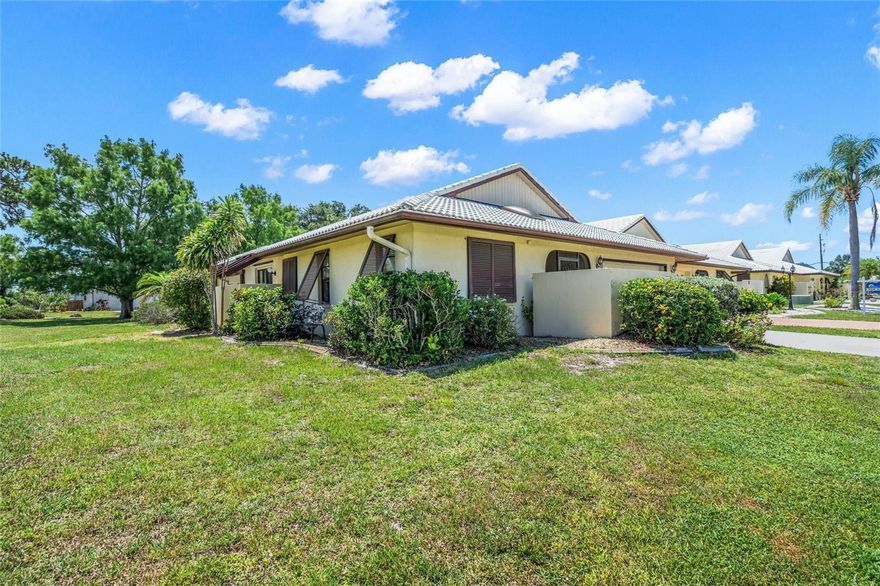 HOURGLASS LAKES, TWO BEDROOMS, TWO BATH, 1770 SQ FT, VILLA WITH PARK-LIKE SETTING & NEW ROOF! Upon entry, you are greeted with an expansive view of the combination living/dining room featuring vaulted ceilings and upgraded luxury vinyl plank flooring. The split floor plan provides privacy for both bedrooms! The primary suite is spacious and provides you with a spacious walk-in closet. Master Bath features dual sinks, a walk-in shower, and a linen closet. The Guest Bedroom is spacious, with three windows providing ample natural light. The kitchen is spacious and provides for the long-lost eat-in kitchen, new cabinetry, and access to a private courtyard. The utility room is spacious and features extra cabinet space, along with a utility sink. HOURGLASS LAKES community is a highly sought-after DEED RESTRICTED COMMUNITY, with PUBLIC WATER AND SEWER, FLOOD ZONE AE, and low $167 monthly HOA fees. Amenities include a heated pool, hot tub, clubhouse, lawn maintenance, pet-friendly, and not age-restricted. Less than 4 miles to Manasota Beach and less than 10 minutes' drive to beautiful, historic downtown Venice.