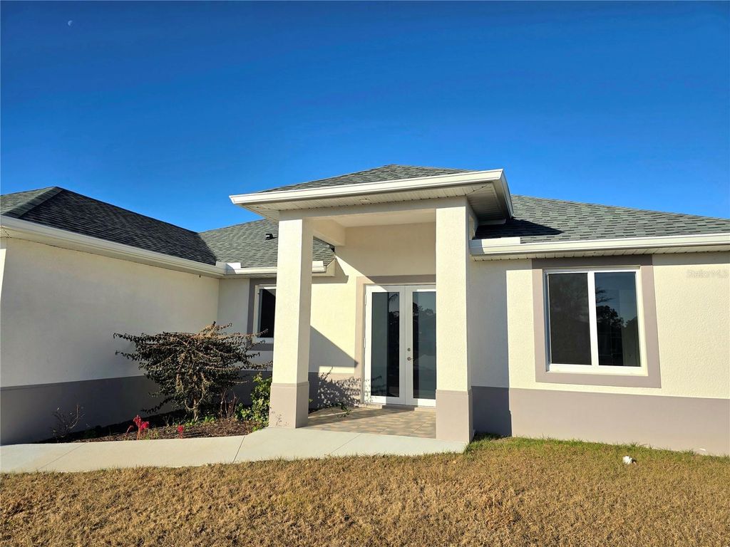 Photo of 1219 Hibiscus Avenue, Lehigh Acres, FL 33972 (MLS # C7521916)