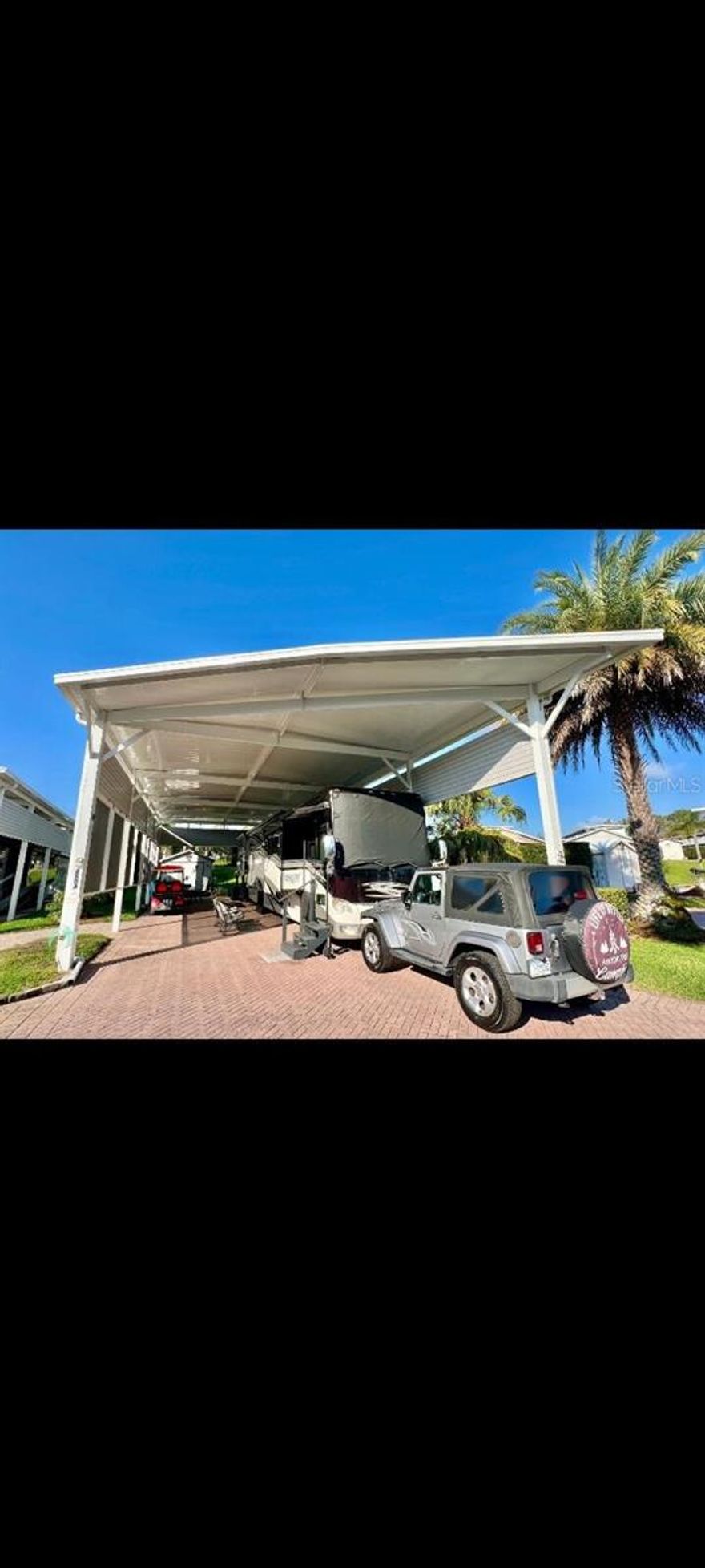 Deer Creek RV & Golf Community    Regal Pointe- Class A Motorhomes.
    50 Amp, Full Hook lot, 64' x 24' paved area on the landscaped 90' x 40' lot with a 64' x 24' Aluminum Port built in 2023 with 6" x 6" posts and solar screening.
   10' x 12' Smithbuilt Shed with Electric, Water, Toilet, Sink, Washer & Dryer, Refrigerator, Microwave, Dehumidifier and a large storage area 
    Newer well water pump to irrigate the Trees, Plants and Grass.
     Large Gazebo for entertaining or just enjoying the tranquil space hidden from the road.
    Active Community with multiple clubhouses, activities, Pools, 18 hole Golf course, multiple bars and restaurants on the premises.