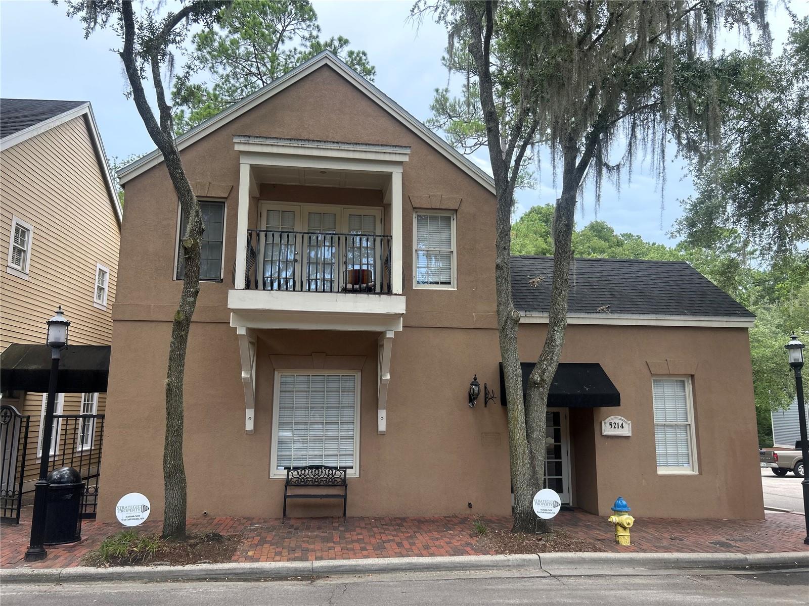 Charming Corner Office/Retail Space in Haile Village Center – Prime LocationStep into the heart of Haile Village Center, Gainesville’s most charming and walkable live-work-play destination. Surrounded by bustling professional offices, boutiques, cafes, and restaurants, this highly visible corner building offers exceptional exposure and curb appeal with windows facing Main Street.Flexible Layout for a variety of uses; medical, creative, consulting, wellness, legal, financial, real estate. Layout offers Reception/lobby entrance and up to 6 private offices plus a sitting room, or a shared workspace configuration for up to 12 - 20 desks plus 2 restrooms. Small kitchenette with mini-fridge open to a versatile common ideal for lounge, open-office, conference or waiting room. Owner will install new wood-style vinyl flooring with a 5-year lease. 1+ year lease with renewal options accepted. Walkable area with ample parking. Vibrant community atmosphere surrounded by successful businessesHaile Village is a sought-after destination for professionals and clients alike—nestled among tree-lined streets, brick paths, and beautifully designed buildings. This is more than just an office—it’s a place your team and clients will enjoy visiting every day.