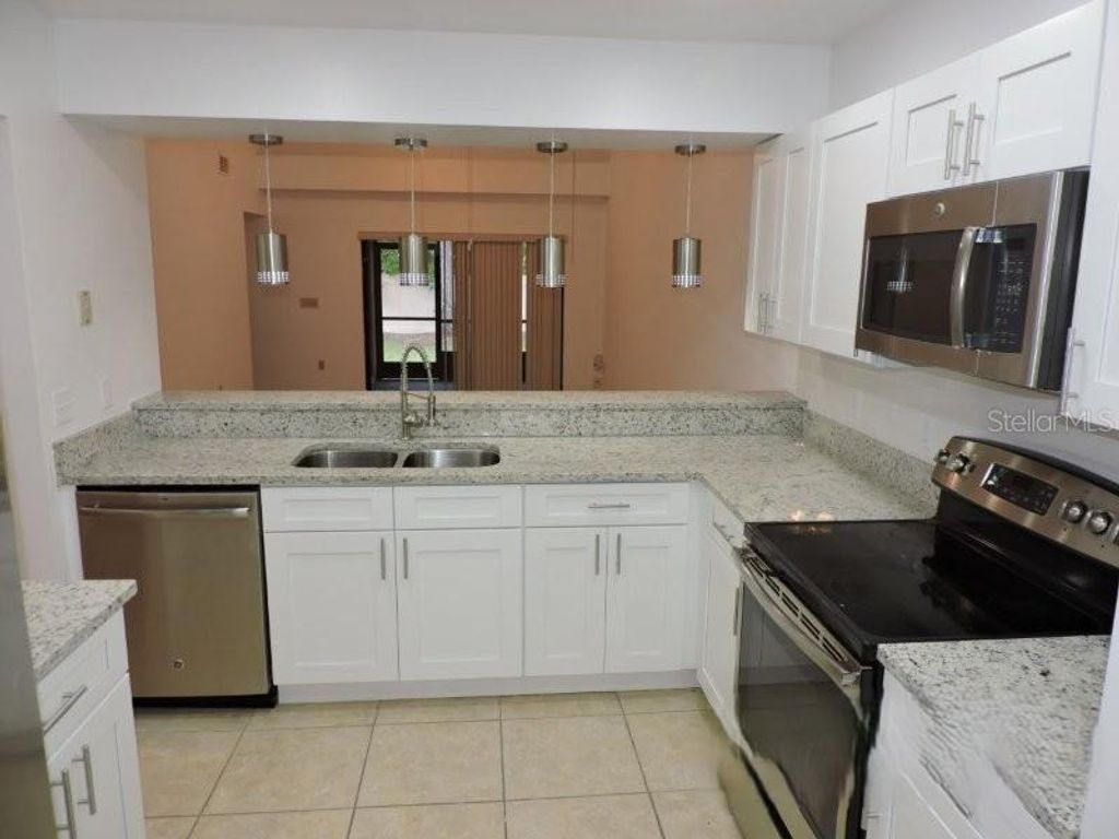 Photo of 8238 Sandpoint Boulevard, Orlando, FL 32819 (MLS # O6381691)