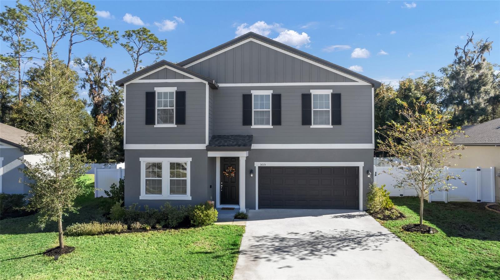 Welcome to Lincoln Oaks, where modern living meets charming small-town vibes! Nestled just outside the historic town of DeLand—affectionately known as ''the Athens of Florida''—this vibrant community is your gateway to all the wonders Central Florida has to offer. Imagine a beautiful 4-bedroom, 2.1-bath haven, boasting over 2,400 square feet of exquisite living space! This stunning model home features an executive package with custom cabinetry, a stylish center island adorned with a chic tile backsplash, and a breathtaking open layout perfect for family gatherings and entertaining friends. With extensive wood-like tile flooring and towering 8-foot doors, your new home exudes contemporary elegance at every turn! But that's not all! Enjoy the privacy of your very own vinyl fenced backyard, ideal for those sunny Florida days and starry nights. Work from home in your convenient downstairs office, and retreat to your luxurious second-story loft at the end of the day. The spacious owner's suite is a true oasis, featuring a tiled walk-in shower and massive walk-in closets! Whether you're taking day trips to Orlando, enjoying the beautiful beaches of Daytona, you're centrally located to all the best attractions! Don't miss your chance to join this vibrant community and settle into the lifestyle you've always wanted.