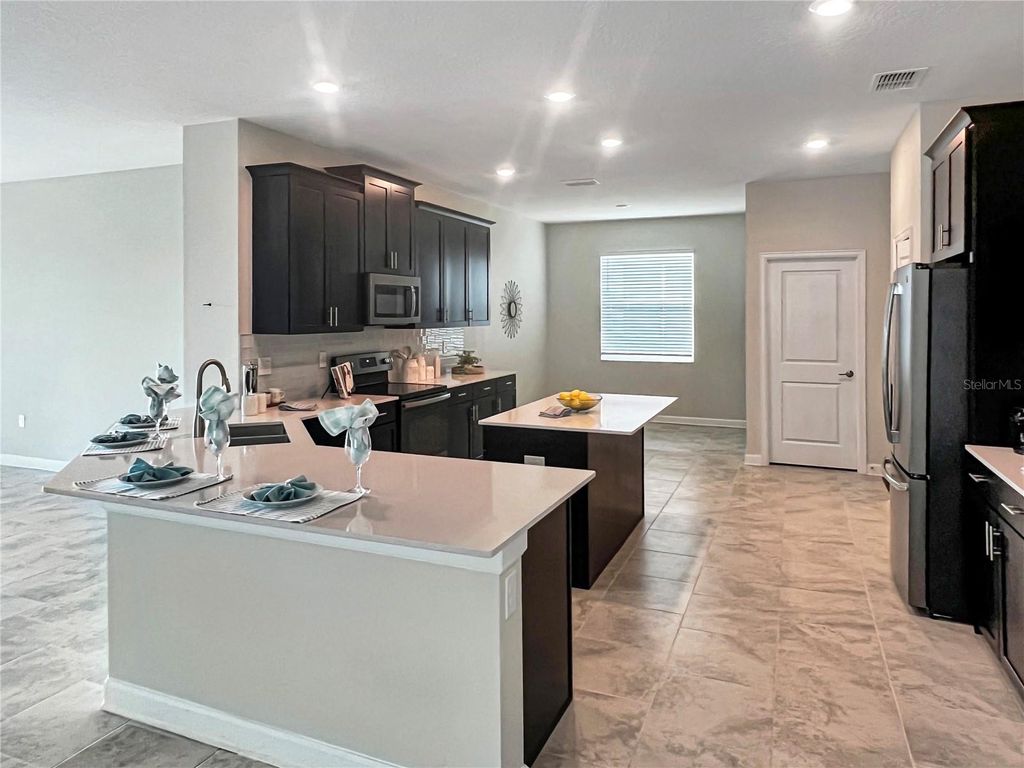 Photo of 2155 Camden Loop, Davenport, FL 33837 (MLS # O6374489)