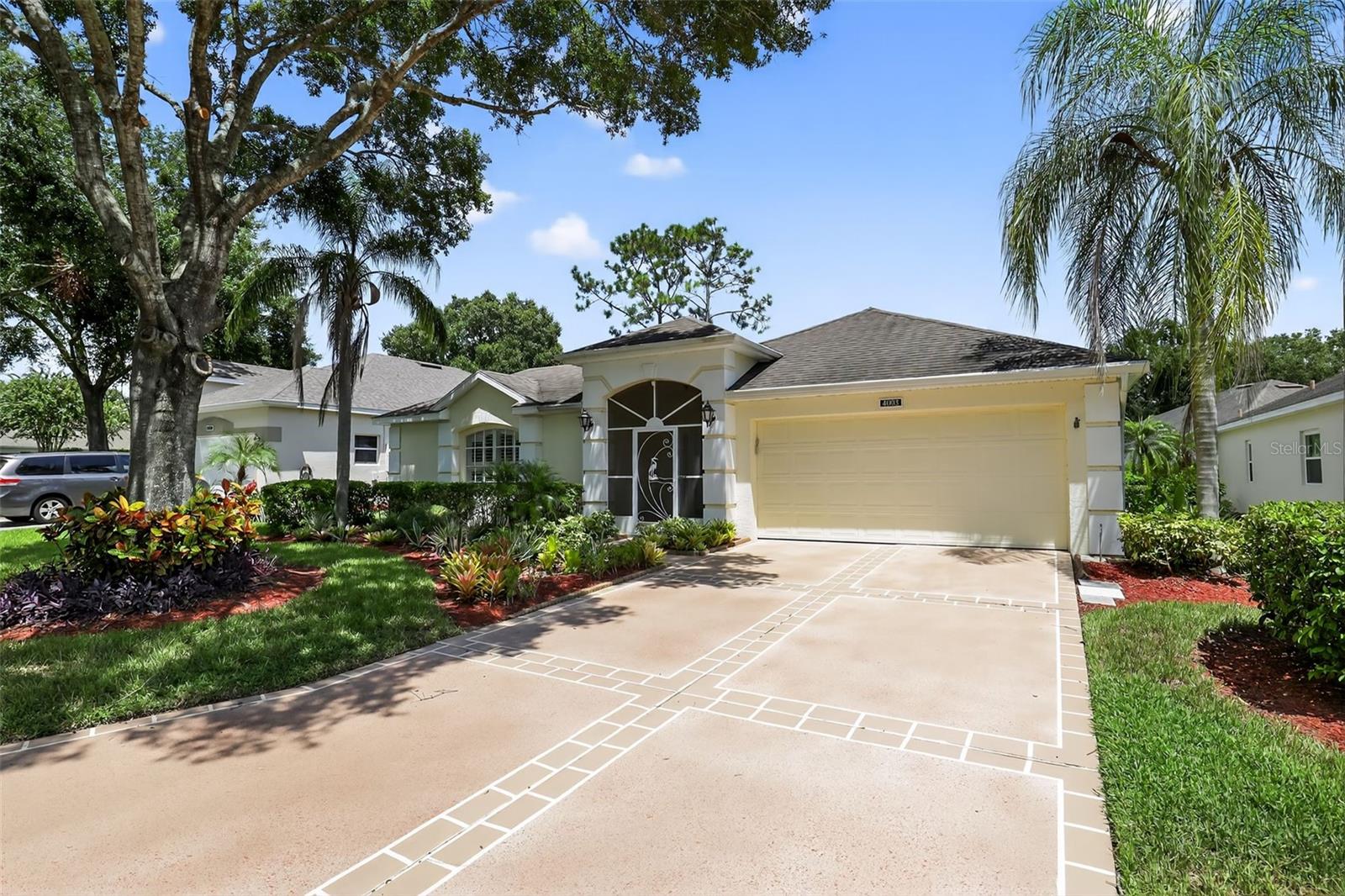 Welcome to 4003 Hammersmith Drive, a beautifully maintained St. Ives II courtyard home nestled in the serene, 55+ gated Kings Ridge community of Clermont. Featuring a private enclosed courtyard, 3 bedrooms (one ideal as an in-law suite), 2 full baths, and a 2-car garage, this home offers comfort and functionality. At the heart of the property, you’ll find a charming open-air courtyard—beautifully decorated—that separates the in-law suite from the rest of the home, creating privacy and a relaxing space to enjoy. The kitchen shines with granite counters and stainless appliances, complemented by plantation shutters and chic tile or laminate flooring. The master suite features both a walk-in shower and garden tub. Relax on the covered back patio, perfect for gardening or serene moments. Enjoy resort-style community amenities like heated pools, fitness center, clubhouse events, tennis & pickleball courts, and golf-cart access to shopping and dining. Turnkey and full of charm—this one is ready for you.