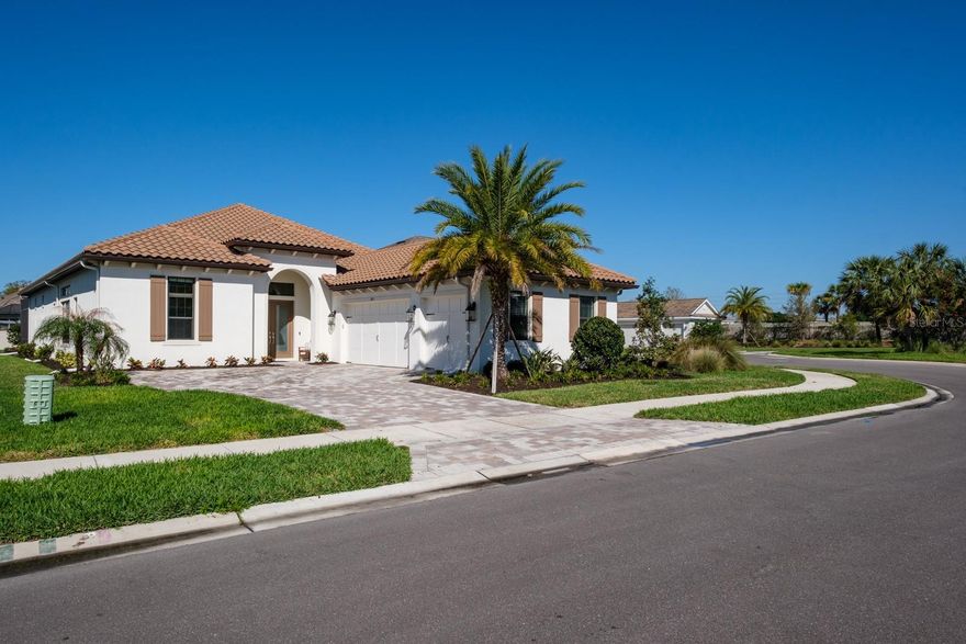 Welcome to luxurious living in the prestigious, gated River’s Edge community. Stunning Taylor Morrison home perfectly combines luxury, style & functionality.  Built in 2022. With over 3,000 sq.ft. this magnificent, immaculate, one-story executive pool home offers 3 bdrms, a study, 3 full bathrooms, 2 half baths and an oversized 3-car garage. Pavered driveway brings you to elegant double glass doors and into the truly open concept floor plan. Gorgeous wood flooring flows throughout the bedrooms and main living area. Formal dining room features trey ceiling, transom window, beverage center with white shaker cabinets including lighted upper cabinets, quartz counters with SS sink, designer tile backsplash & beverage fridge. Stunning gourmet kitchen will impress the finest chef with the oversized island, quartz counters, soft close wood cabinetry with crown molding, upper and lower cabinet lighting, breakfast bar with lower cabinetry, farmhouse sink, hood, SS appliances including GE Monogram built-in convection oven, microwave, 6-burner gas cooktop, dishwasher and a GE Cafe refrigerator.  The kitchen provides an abundance of counter space for preparing and entertaining family and friends.  Enormous walk-in pantry with wood shelving is the ultimate space needed for serving and storage.  Separate large eat-in area compliments the kitchen with sliding glass doors overlooking the fabulous pool views. Kitchen overlooks spacious great room boasting trey ceiling, transom window and sliding glass doors to the outdoor lanai.  Living and entertaining is extended with your outdoor oasis. Magnificent travertine tile lanai, enormous pool with pebbletech finish, vaulted mansared screen enclosure, outdoor shower, cabana pool half bathroom, two large, covered areas with poolside kitchen boasting granite counters, beverage fridge, grill and sink and an additional covered space includes a sitting area with a mounted TV and cozy gas fireplace for year-round entertainment. Split bedroom floor plan is ideal for privacy with spacious primary bedroom located in the rear of the home offering trey ceiling w/crown molding, transom windows, 2 walk-in closets with custom closet systems, ensuite bath features dual vanities with wood cabinetry, quartz counters with undermount sinks, dressing/makeup area, garden tub, water closet and frameless glass walk-in shower with designer tile accents. Two additional bedrooms located at the front of the home each boast crown molding and a private ensuite. The second half bath is perfectly situated in the hallway for guests’ convenience. Double door entry to the private study with trey ceilings is perfect for home office or separate sitting area.  Laundry room is ideally located inside the home just off the garage entrance and features a utility sink and separate linen center with upper and lower cabinetry making a great folding area... GE Profile washer & dryer convey!  Other notable upgrades include central vacuum, epoxy flooring in garage, living room and outdoor area are pre-wired for surround sound.  River’s Edge residents enjoy the full River Landing community. It is a master planned community with remarkable amenities and provides a resort-style lifestyle. The impressive array of amenities include a fabulous pool, clubhouse & fitness center, tennis & basketball courts, soccer field, playground, dog park. A stunning home in a sought-after community offering the best of Forida living!