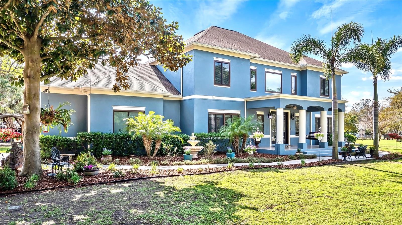 Luxury estate in Central Florida offering a VA assumable loan at 2.5 percent, zoned for horses and approved for a home-based business. Set on nearly two acres in North Lakeland, 3943 W. Campbell Road presents a rare opportunity to own a six-bedroom, 3.5-bath custom residence spanning 4,227 square feet. The home delivers a blend of rural privacy with seamless access to Orlando, Tampa and the region’s premier amenities. Enter through 8-foot French doors into a grand foyer with soaring 25-foot ceilings and an expansive, open layout — ideal for entertaining or multigenerational living. The remodeled chef’s kitchen boasts quartz countertops, solid wood cabinetry, stainless steel appliances and a gas stove with a custom hood. The first-floor primary suite includes dual walk-in closets and a skylit bath with premium finishes. The second floor offers five additional bedrooms, including a Jack-and-Jill configuration with a shared walk-in closet. Performance features include Category 5-rated Andersen windows and doors, a new roof (2021), three air-conditioning units (2022), upgraded attic insulation (2023) and a new 74-gallon propane water heater. Technology upgrades include electronic blinds, Ring security cameras and a dual washer-dryer laundry chute system. The property also features a gas fireplace, 50-amp RV hookup, two utility sheds with electric and an oversized two-car garage. Outdoor living is enhanced by two covered porches, a side patio and a well-water irrigation system. In an exclusive seven-home enclave with no HOA or CDD, this estate offers zoning flexibility, equestrian possibilities and business potential.